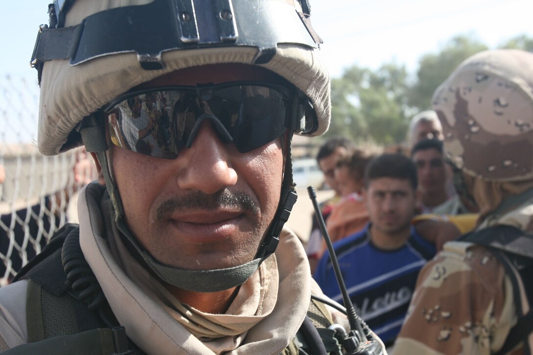 KABANI, Iraq (Oct. 27, 2007) ? Iraqi soldiers work with U.S. forces during a cooperative medical engagement here. They worked to regulate patient flow while Iraqi and U.S. medical personnel examined and treated patients.