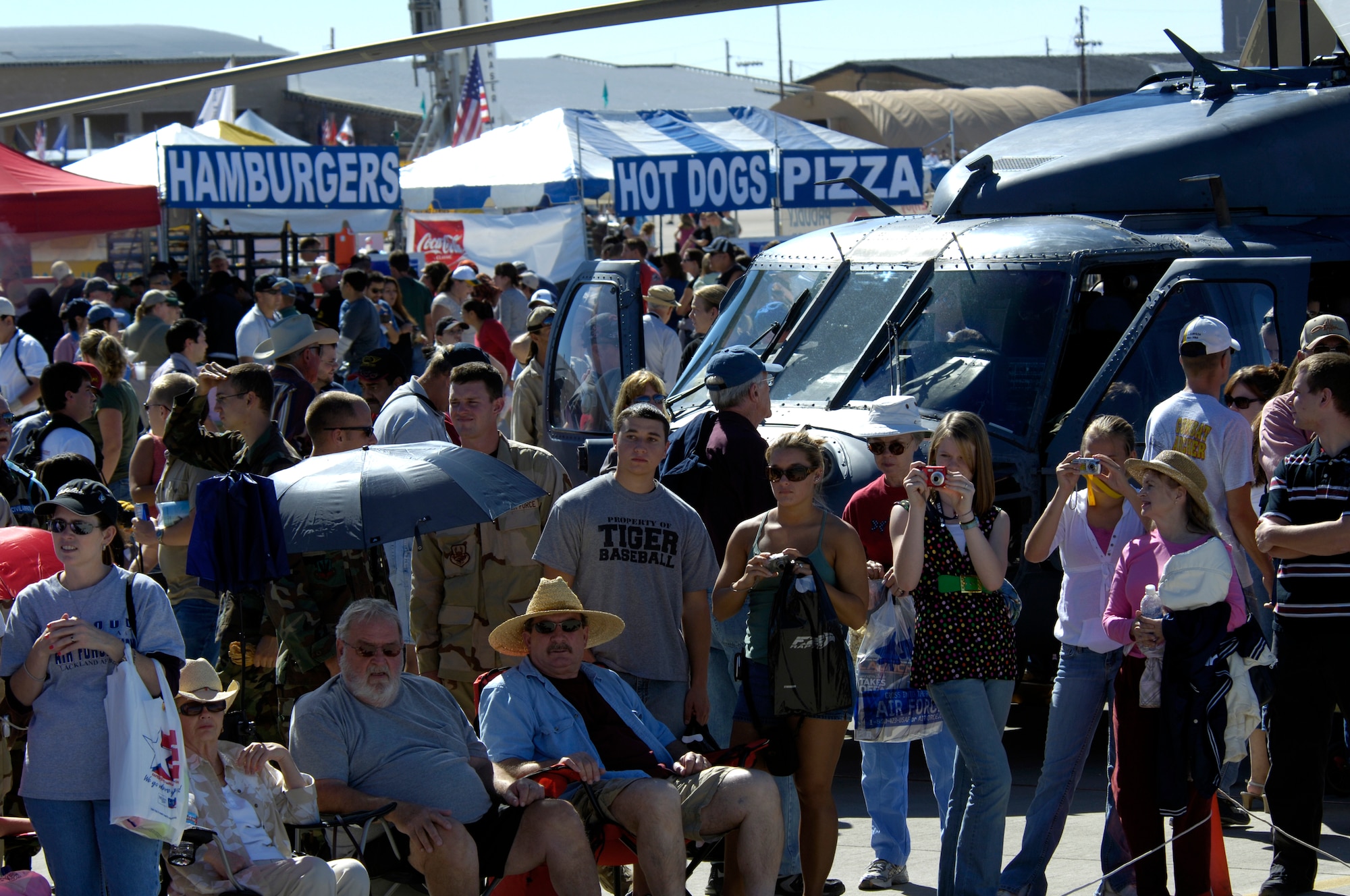 Spectators watch aircraft and parachutist perform during the Holloman Air and Space Expo on October 27 2007. The Holloman Air and Space Expo is a showcase of Air Force capabilities, the 49th Fighter Wing mission and the X Prize Foundation (U.S. Air Force Photo by Staff Sgt Jason Colbert)