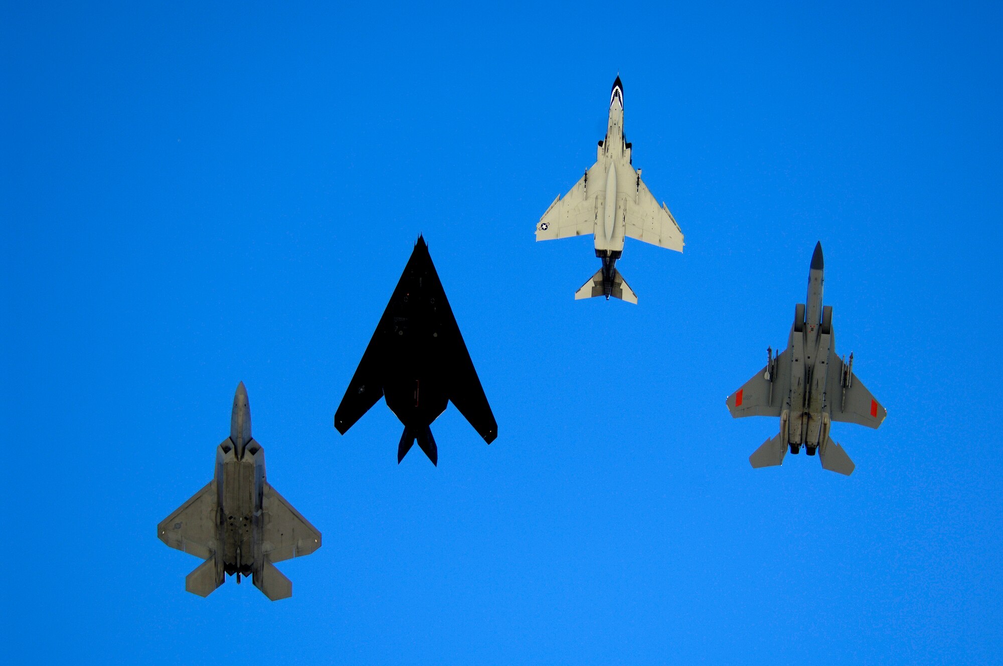 An F-117, F-22, F-4 and an F-15 fly over Holloman AFB, NM while performing a Holloman Legacy Flight on October 27 2007. The Holloman Air and Space Expo is a showcase of Air Force capabilities, the 49th Fighter Wing mission and the X Prize Foundation (U.S. Air Force Photo by Staff Sgt Jason Colbert)
