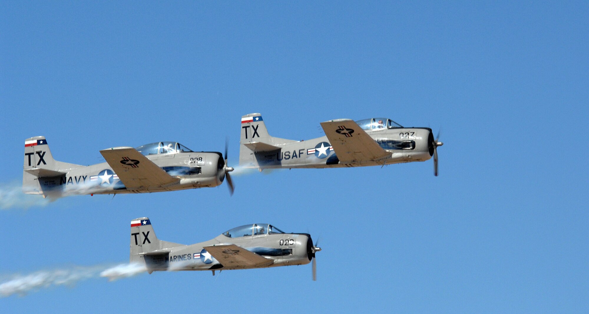 The Trojan Phlyers Air Race & Air Show Team from Fort Worth, Texas, perfom at the Holloman Air and Space Expo. The team performed their routine in front of 25,000 spectators. The HASE is a showcase of Air Force capabilities, the 49th Fighter Wing mission and the X Prize Foundation.(US Air Force photo by Airman 1st Class Tiffany Trojca)