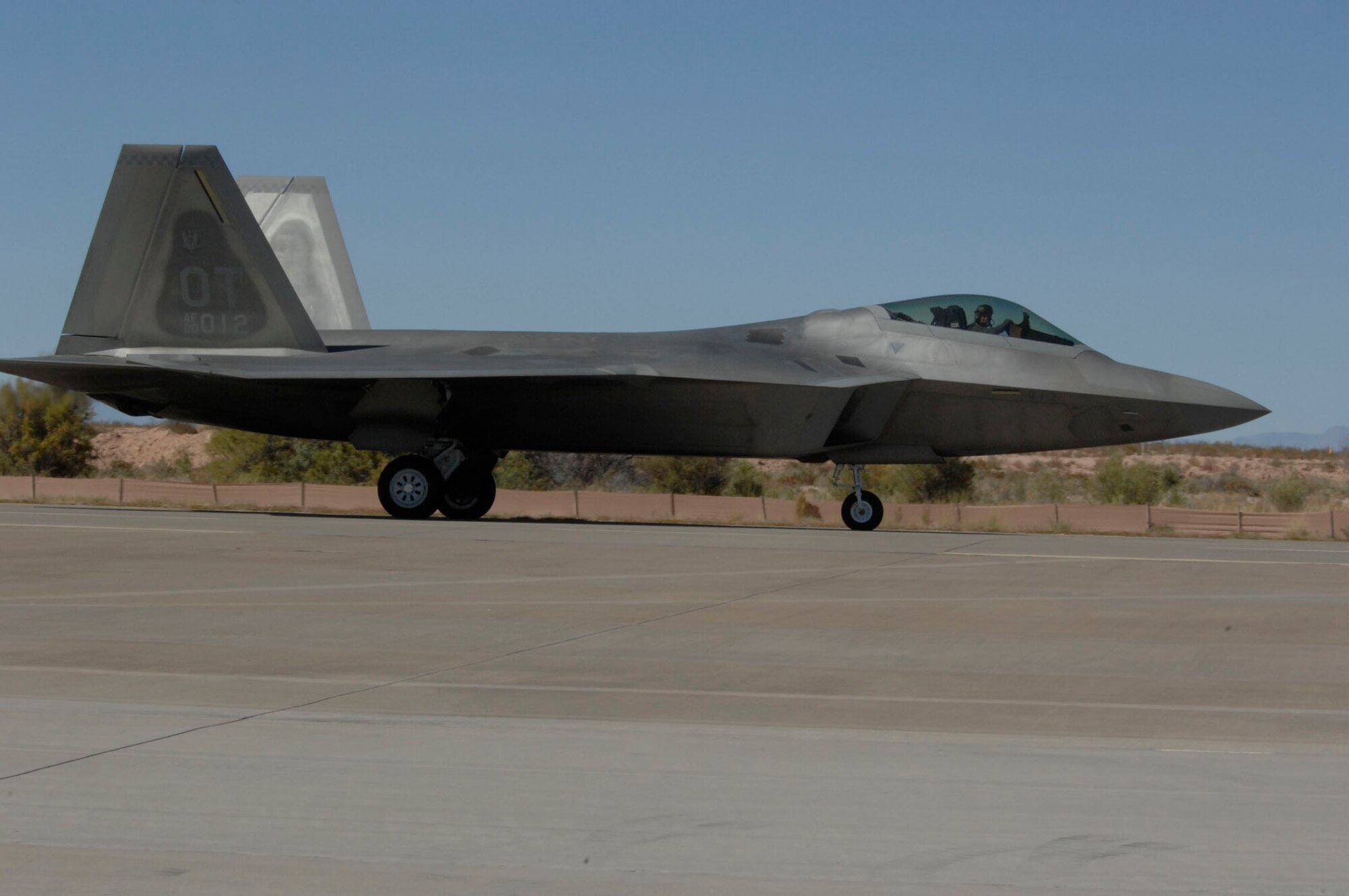 The F-22A Raptor taxies onto the flightline after a practice flight during The Holloman Air and Space Expo on Oct. 26. The HASE is a showcase of Air Force capabilities, the 49th Fighter Wing mission, and the X Prize Foundation.(U.S. Air Force photo/Airman 1st Class Rachel Kocin)