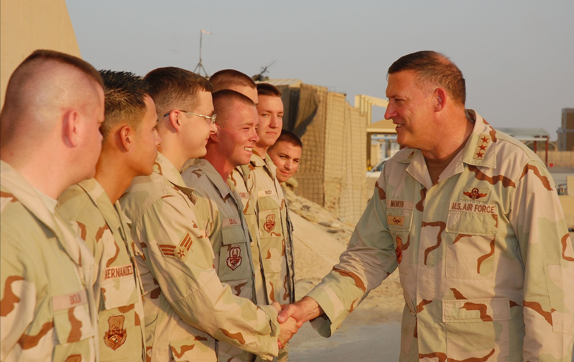 SOUTHWEST ASIA -- Lt. Gen. Gary North, 9th Air Force and U.S. Central Command Air Forces commander, greets Senior Airman Luke Arnold and other members of the 386th Expeditionary Maintenance Squadron at an undisclosed location in Southwest Asia Oct. 25.  General North observed operations and spoke with deployed Airmen from units around the world while visiting the 386 AEW.  (U.S. Air Force photo by Staff Sgt. Tia Schroeder)  


