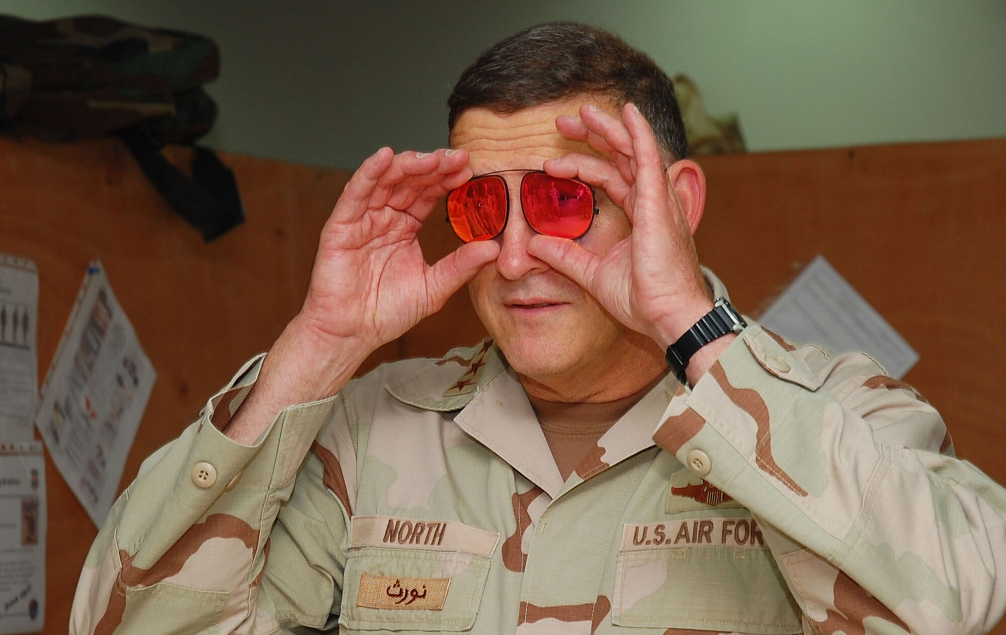 SOUTHWEST ASIA -- Lt. Gen. Gary North, 9th Air Force and U.S. Central Command Air Forces commander, tests out a set of aircrew laser eye protection glasses while visiting with deployed Airmen from the 386th Expeditionary Operations Group at an undisclosed location in Southwest Asia Oct. 25.  The laser eye protection is used by aircrew pilots to protect their eyes from lasers that are being used by insurgents from the ground.  (U.S. Air Force photo by Staff Sgt. Tia Schroeder)  


