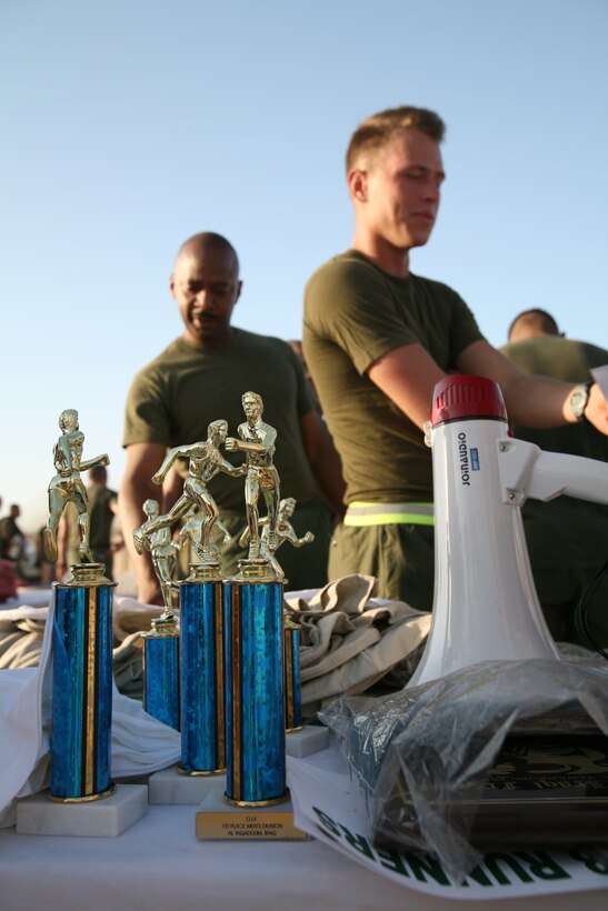 AL TAQADDUM, Iraq (Oct. 28, 2007) ? Service members wait in line to receive a Halloween 5k run T-shirt after completing the event Oct. 28.  Nearly 500 service members and civilian contractors aboard Al Taqaddum participated in the run.