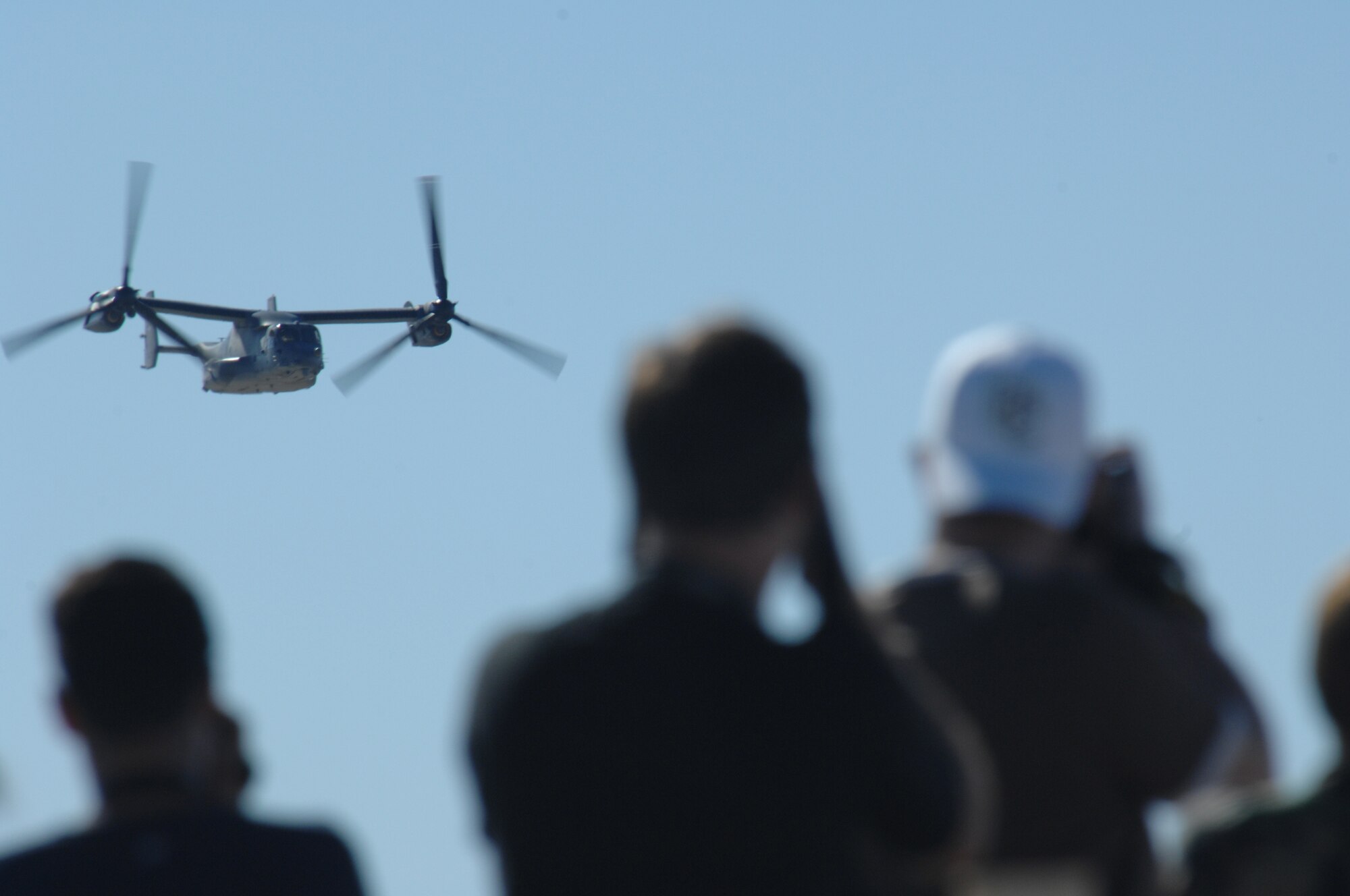 Members of the Alamogordo community and surrounding New Mexico areas watch a CV-22 Osprey demonstration Oct. 28, 2007, during the Holloman Air and Space Expo. The HASE is a showcase of Air Force capabilities, the 49th Fighter Wing mission and the X Prize Foundation. (U.S. Air Force photo by Airman 1st Class Jamal Sutter)