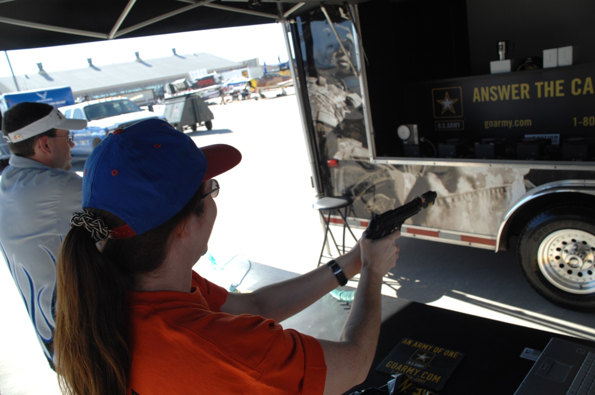 George Torres of Albuquerque, N.M., and Margaret Bohlin of Roswell, N.M., practice their aim on the Army Marksmanship Trainer Beamhit System Oct. 28, 2007, during the Holloman Air and Space Expo. The HASE is a showcase of Air Force capabilities, the 49th Fighter Wing mission and the X Prize Foundation. (U.S. Air Force photo by Airman 1st Class Jamal Sutter)