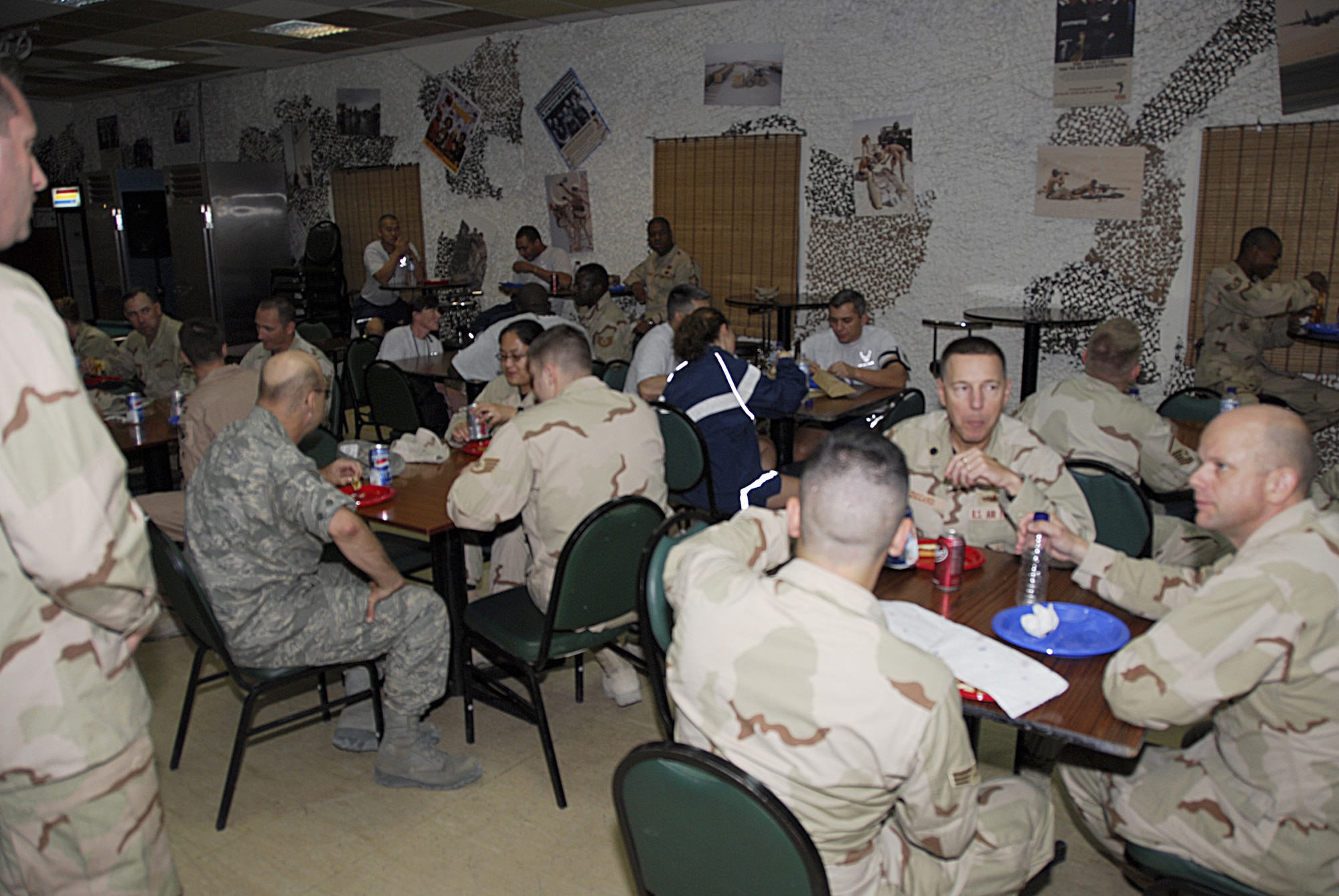 SOUTHWEST ASIA - Members of the 379th Air Expeditionary Wing gather for a pizza party as part of the wrap-up for the Wing Staff Agency?s Wingman Week Oct. 26. (U.S. Air Force photo/Staff Sgt. Douglas Olsen)