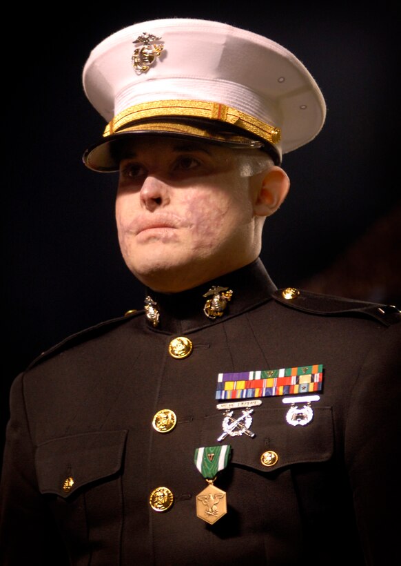 Marine 1st Lt. Dan Moran is awarded the Navy Commendation Medal with Valor for his efforts in Iraq during half-time of the University of Kansas-Texas A&M football game in College Station, Texas, Oct. 27, 2007.  
