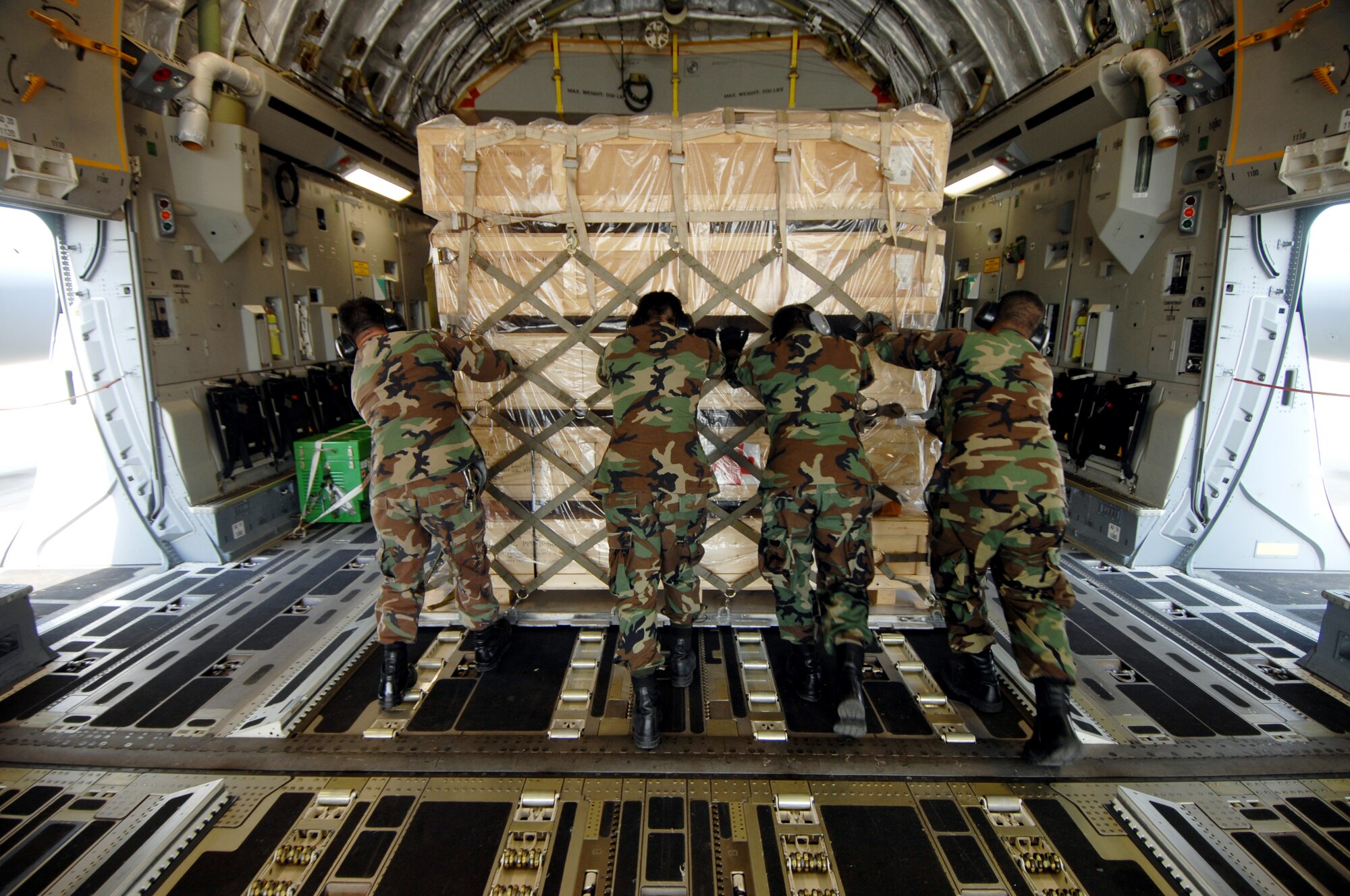 Aerial porters from the 452nd AMW at March Air Reserve Base, Calif., load medical supplies and equipment from the 375th AES aboard a C-17A Globemaster Sunday October 28, 2007. The 375th is redeploying to Scott AFB, IL. The 375th AES was assigned to the Mobile Aeromedical Staging Facility at March Air Reserve Base, Calif., in support of medical relief efforts for the California wildfires. The 375th along with other aeromedical components from Pope AFB, N.C., and Travis AFB, Calif., were on standby to air-evacuate fire victims out of the local area. U.S. Air Force photo by MSgt Rick Sforza (RELEASED)
