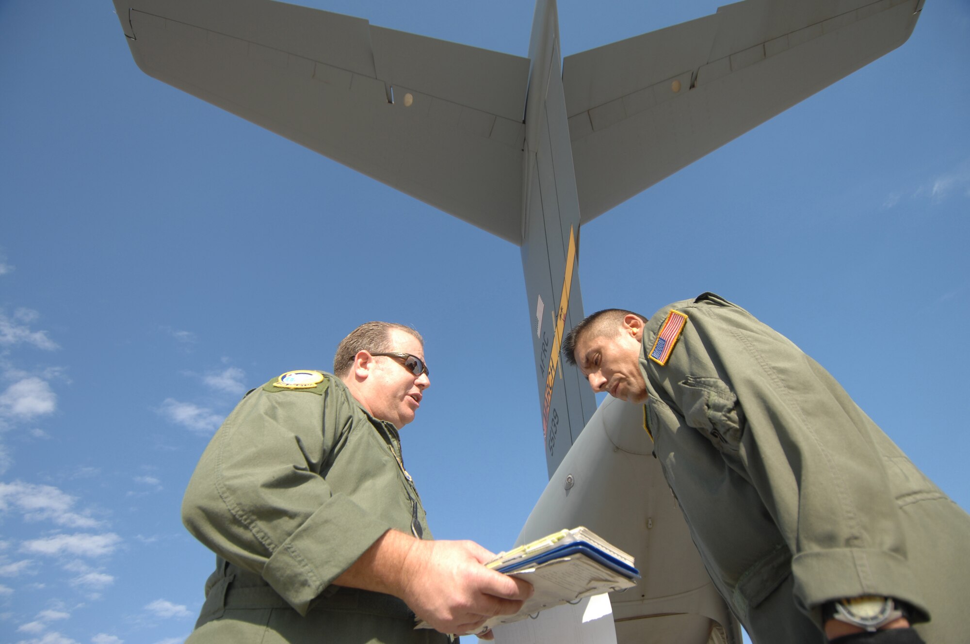 TSgt Lance Augustine, left and TSgt Sergio Melendez, loadmasters from the 729th AS at March Air Reserve Base, Calif., prepare to load a C-17A Globemaster Sunday October 28th, 2007. The C17 crew is redeploying the 375th to Scott AFB, IL. The 375th AES was assigned to the Mobile Aeromedical Staging Facility at March Air Reserve Base, Calif., in support of medical relief efforts for the California wildfires. The 375th along with other aeromedical components from Pope AFB, N.C., and Travis AFB, Calif., were on standby to air-evacuate fire victims out of the local area. U.S. Air Force photo by MSgt Rick Sforza (RELEASED)