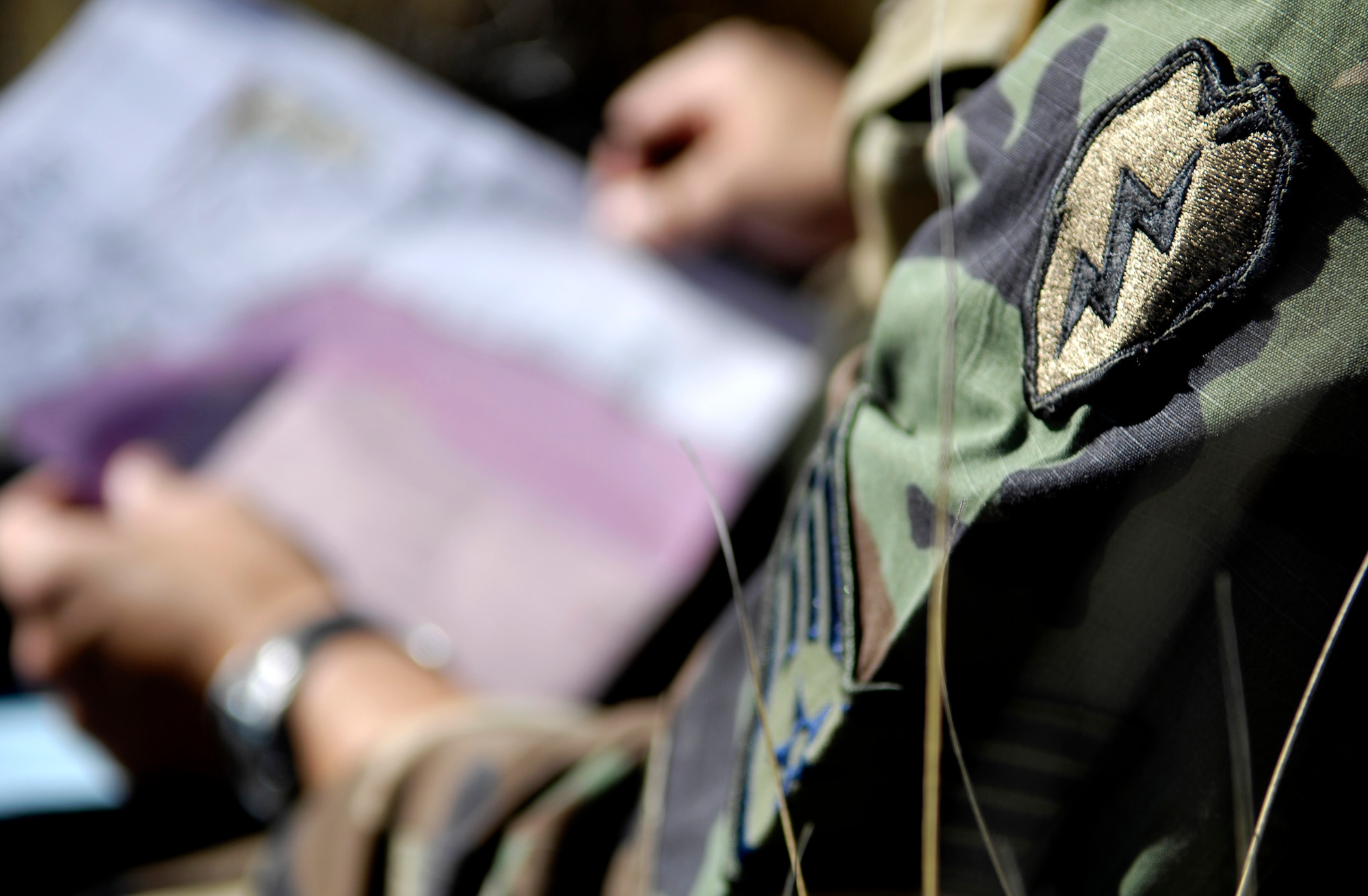 Staff Sgt. George Earhart looks over a range map Oct. 23, 2007 at the Pohakuloa Training Area on the island of Hawaii. Sgt. Earhart is a tactical air controller from the 25th Air Support Operations Squadron, Wheeler Army Air Field, Hawaii. The TAC-Ps are training as part of the Koa Lightning exercise where bombers fly from Guam and practice their targeting. Currently deployed B-2 Spirit bombers are at Andersen Air Force Base, Guam as part of the continuous bomber presence mission. Rotational bomber deployments to Guam help maintain stability and security in the region while allowing stateside-based units to become familiar with operating in the Pacific Theater. (U.S. Air Force photo/Tech. Sgt. Shane A. Cuomo)