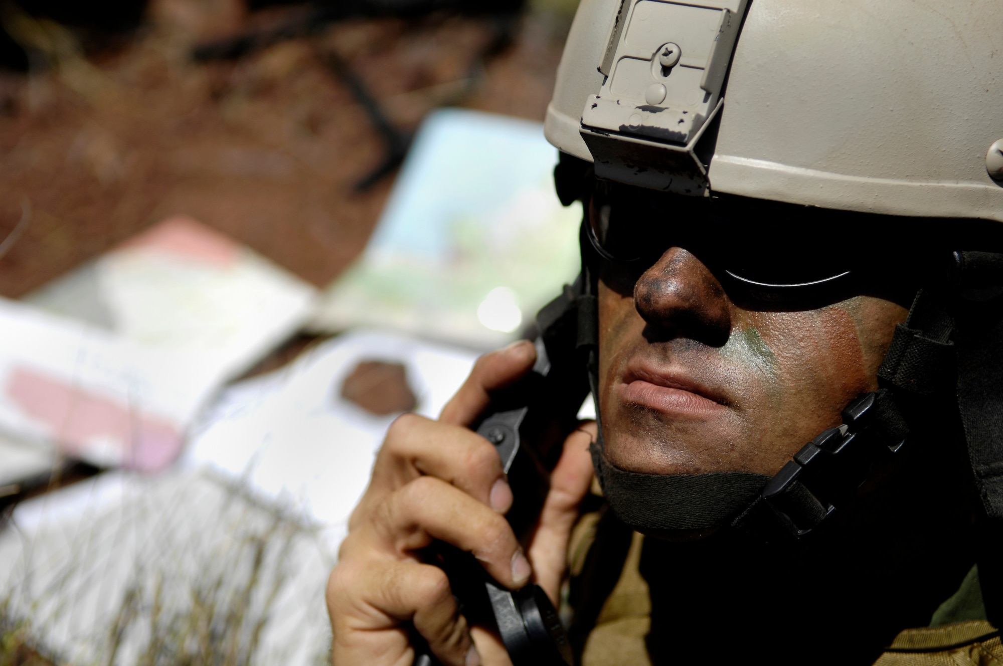 Airman 1st Class Robert Gaines calls in an air strike Oct. 23, 2007 at the Pohakuloa Training Area on the island of Hawaii. Airman Gaines is a tactical air controller from the 25th Air Support Operations Squadron, Wheeler Army Air Field, Hawaii. The TAC-Ps are training as part of the Koa Lightning exercise where bombers fly from Guam and practice their targeting. Currently deployed B-2 Spirit bombers are at Andersen Air Force Base, Guam as part of the continuous bomber presence mission. Rotational bomber deployments to Guam help maintain stability and security in the region while allowing stateside-based units to become familiar with operating in the Pacific Theater. (U.S. Air Force photo/Tech. Sgt. Shane A. Cuomo)