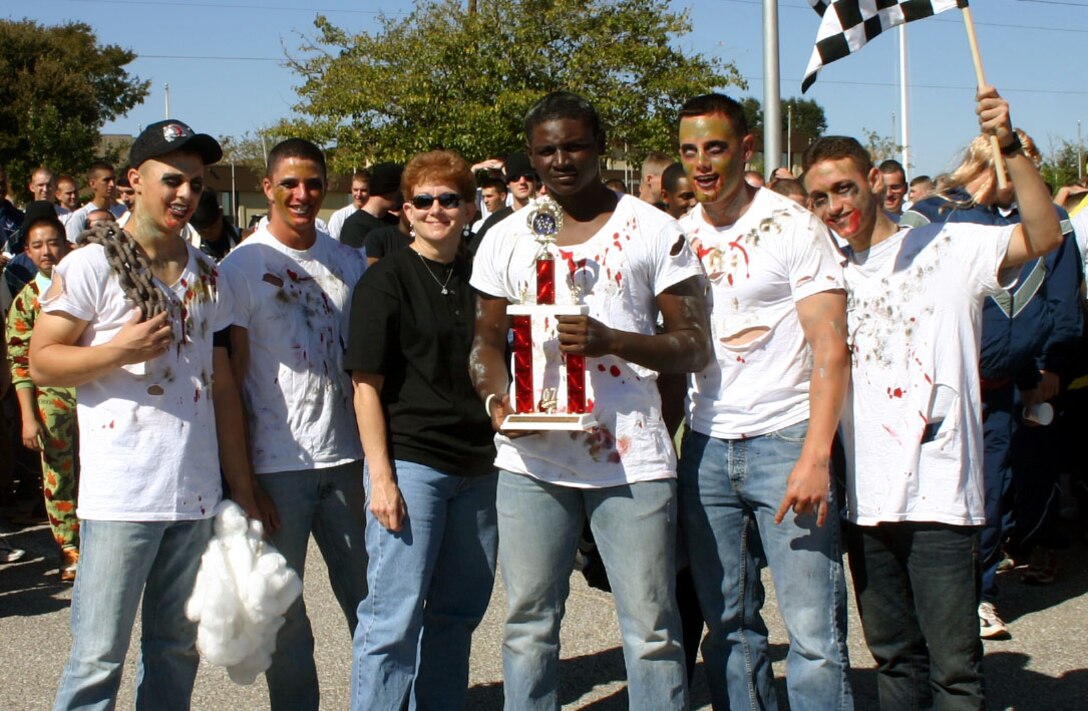 The 362nd Training Squadron's "Ramrods" team poses with 82nd Training Wing Command Chief Chief Master Sgt. Jeannie McLean after the Bed Race at the Community Activity Center Oct. 27. The team won trophies for most spirited team and best overall score. (U.S. Air Force photo/Staff Sgt. Tonnette Thompson)