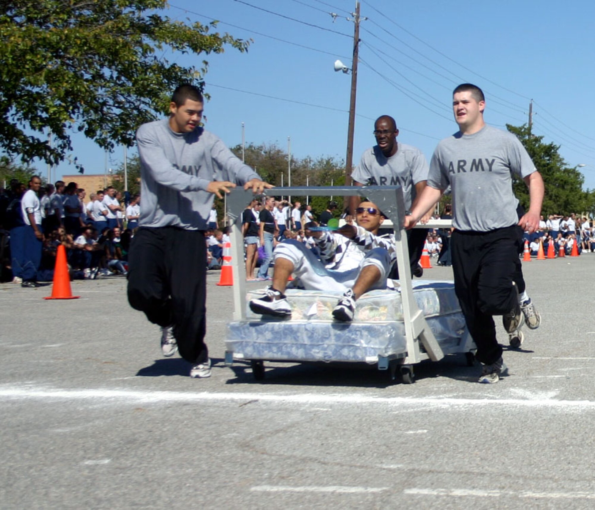 The 264th Delta Company's "Army Dragons" race across the finish line during the Bed Race at the Community Activity Center Oct. 27.  The team won for completing the race with the fastest time. (U.S. Air Force photo/Staff Sgt. Tonnette Thompson)
