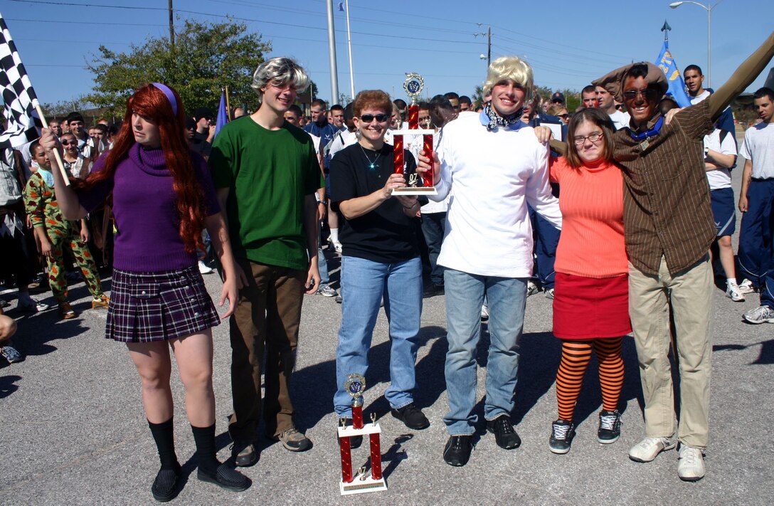 Team Scooby Doo poses with 82nd Training Wing Chief Chief Master Sgt. Jeannie McLean after the Bed Race Oct. 27.  The team won for best costumes and decorations. (U.S. Air Force photo/Staff Sgt. Tonnette Thompson)