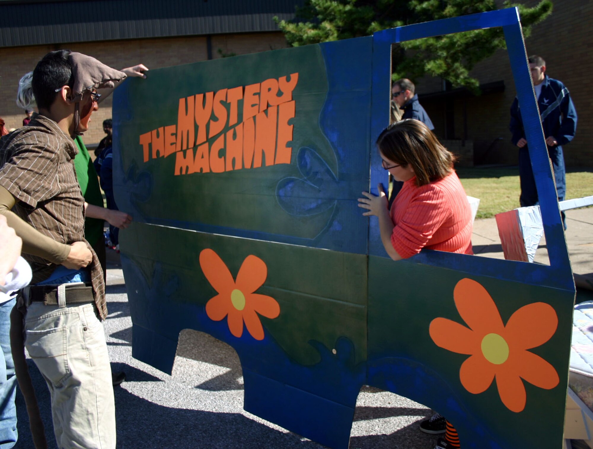 360th Training Squadron's Airman Jerome Salgado and Airman Karina Whittington of Team Scooby Doo prepare to decorate their "Mystery Machine" before the Bed Race Oct. 27.  The race was held at the Community Activity Center. (U.S. Air Force photo/Staff Sgt. Tonnette Thompson)