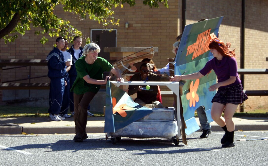 Team Scooby Doo runs against both the wind and their competitors during the Bed Race Oct. 27.  The race was held at the Community Activity Center. (U.S. Air Force photo/Staff Sgt. Tonnette Thompson)