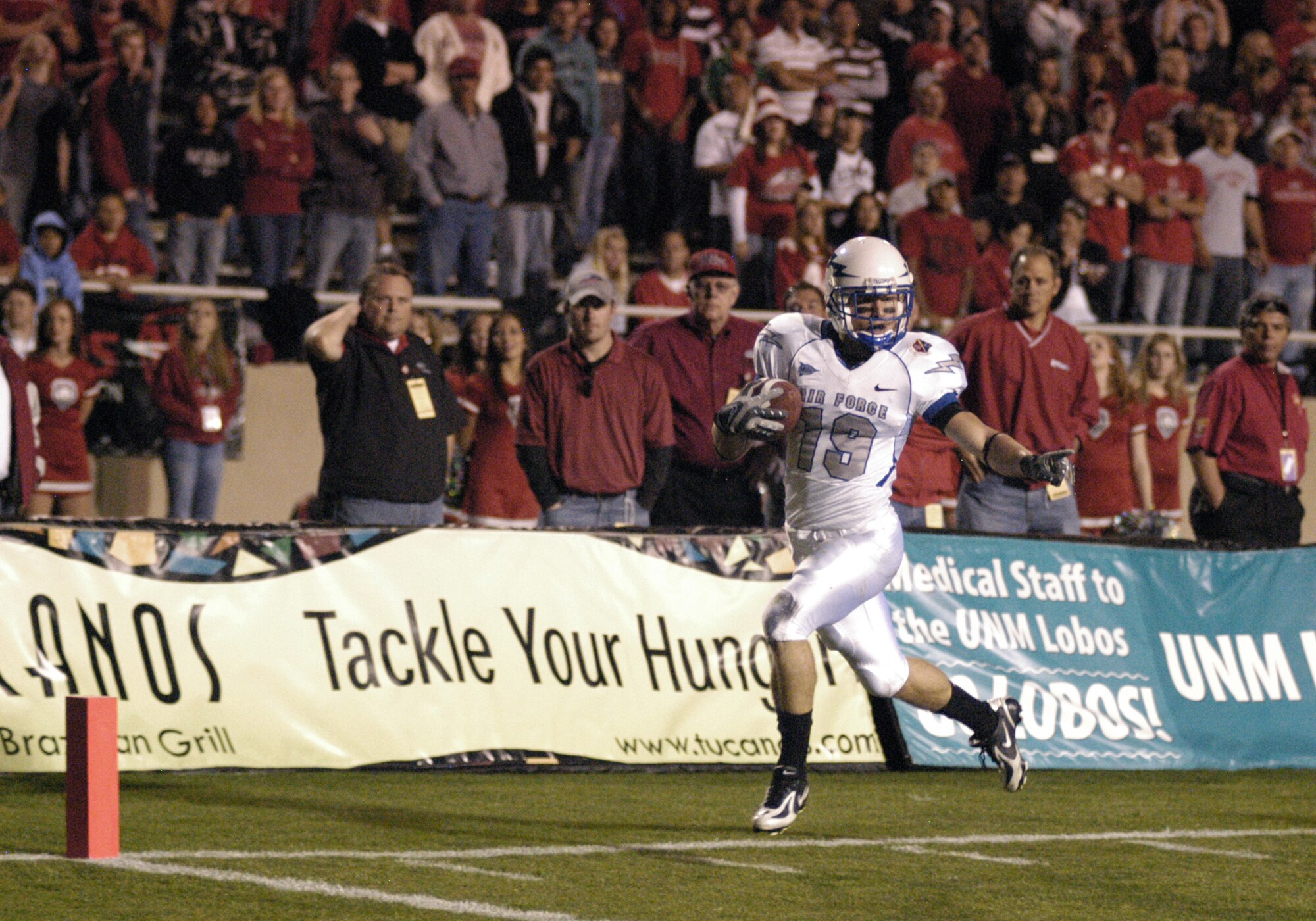 Falcon wide receiver Ty Paffett sprints for a 21-yard end around touchdown in the second quarter of Air Force's 34-31 loss to New Mexico Oct. 25 at University Stadium in Albuquerque. The Falcons ran 49 times for 212 yards on the ground. (U.S. Air Force photo/John Van Winkle) 