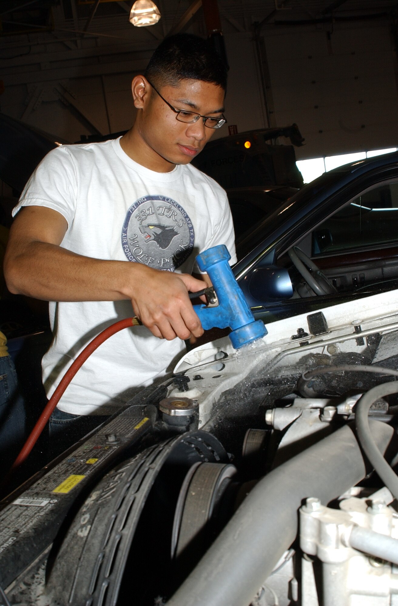 Airman 1st Class Sokunthea Phan, 341st Logistics Readiness Squadron, cleans the area around the battery during a vehicle inspection at Malmstrom Oct. 27. Volunteers from the 341st LRS provided free vehicle inspections for two consecutive weekends as a way to help prepare the base community for Montana’s upcoming winter driving season. (U.S. Air Force photo/Staff Sgt. Marcus McDonald)
