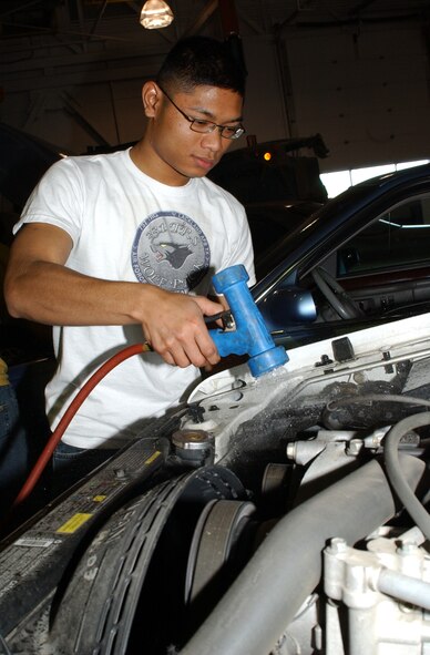 Airman 1st Class Sokunthea Phan, 341st Logistics Readiness Squadron, cleans the area around the battery during a vehicle inspection at Malmstrom Oct. 27. Volunteers from the 341st LRS provided free vehicle inspections for two consecutive weekends as a way to help prepare the base community for Montana’s upcoming winter driving season. (U.S. Air Force photo/Staff Sgt. Marcus McDonald)