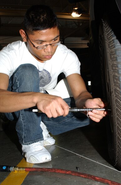 Airman 1st Class Sokunthea Phan, 341st Logistics Readiness Squadron, checks the tire pressure on a vehicle at Malmstrom Oct. 27. Volunteers from the 341st LRS provided free vehicle inspections for two consecutive weekends as a way to help prepare the base community for Montana’s upcoming winter driving season. (U.S. Air Force photo/Staff Sgt. Marcus McDonald)