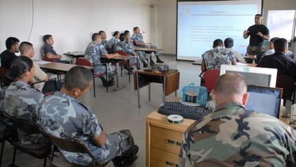 SOTO CANO AIR BASE, Honduras -- Air Force Staff Sgt. Edgar Castro, Joint Security Forces, reviews crime scene procedures with police from nearby Comayagua and La Paz police divisions, as well as cadets from the La Paz Police Academy.  The course is one in a series of classes taught this year, with other lessons involving handcuff procedures, high-risk traffic stops and riot control.  (U.S. Air Force photo/Tech. Sgt. Sonny Cohrs)