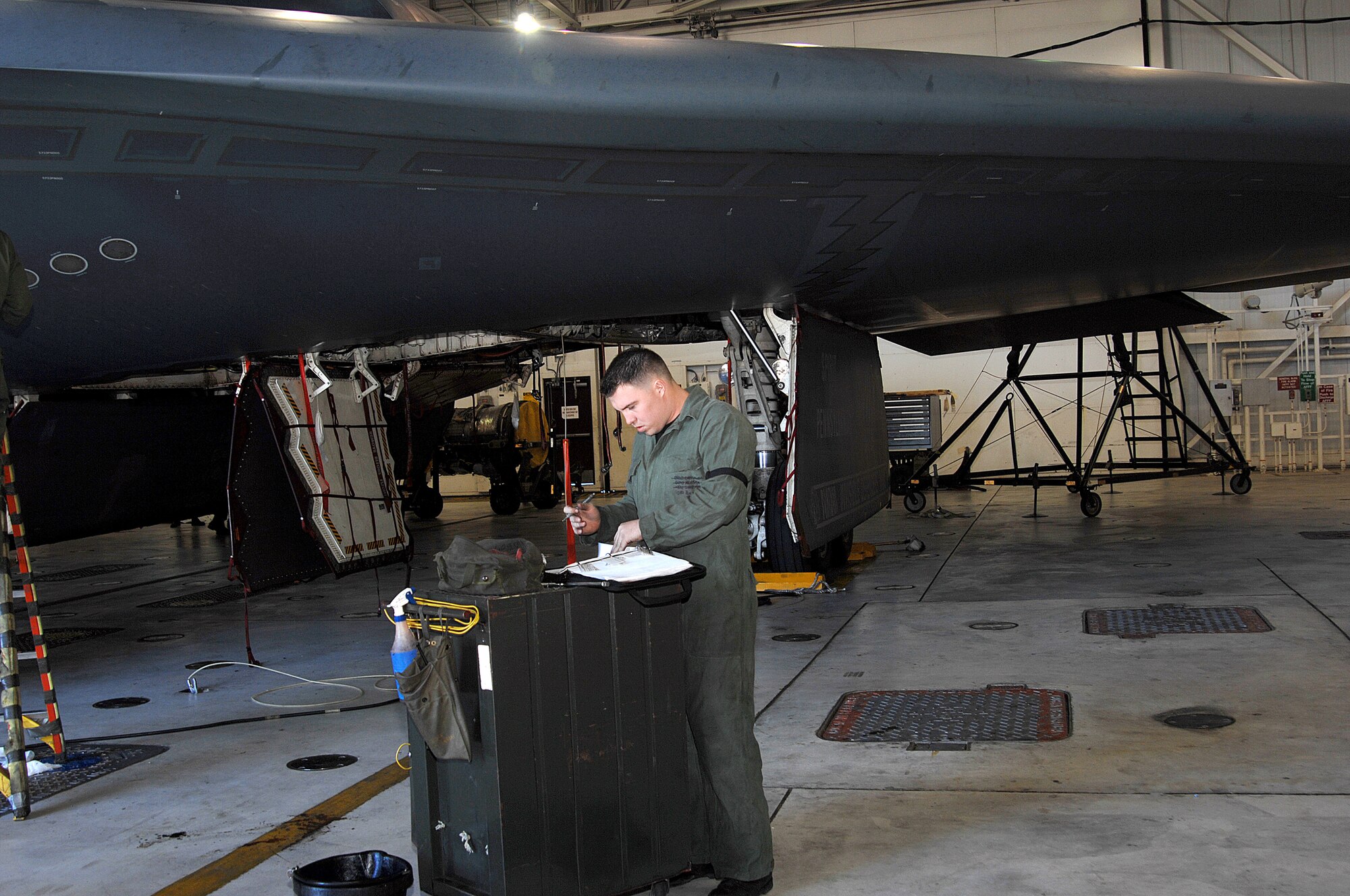 WHITEMAN AIR FORCE BASE, Mo. – Senior Airman Scott Kures, 509th Aircraft Maintenance Squadron who is also the crew chief of the Spirit of Pennsylvania, reviews forms before maintenance is performed on the aircraft Oct. 24.(U.S. Air Force photo/Tech. Sgt. Samuel A. Park)