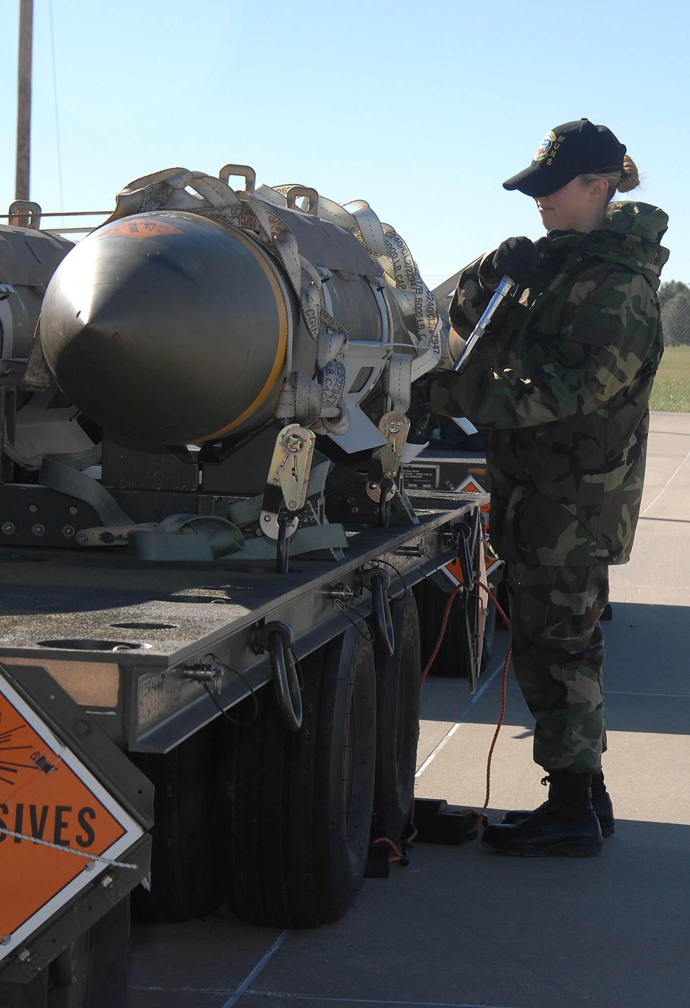WHITEMAN AIR FORCE BASE, Mo. – Senior Airman Cari Eggum, 509th Munitions Squadron, checks the torque settings on a tailkit Oct. 24. (U.S. Air Force photo/Tech. Sgt. Samuel A. Park)