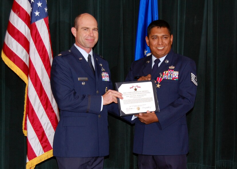 LAUGHLIN AIR FORCE BASE, Texas - Tech. Sgt. Natividad "Nat" Ruiz smiles for the camera with Deputy Mission Support Group Commander Lt. Col. Steve Browning after receiving the Bronze Star Medal for actions during the past year he spent east of Baghdad at an Iraqi Army Base. During the tour, he averted a potentially deadly riot when suspected insurgent activity threatened the base's food supply chain. The sergeant returned to duty at the 47th Force Support Squadron on Oct. 8 and married Patty Ruiz the morning he received his Bronze Star. (U.S. Air Force Photo/Capt. Ken Hall) 