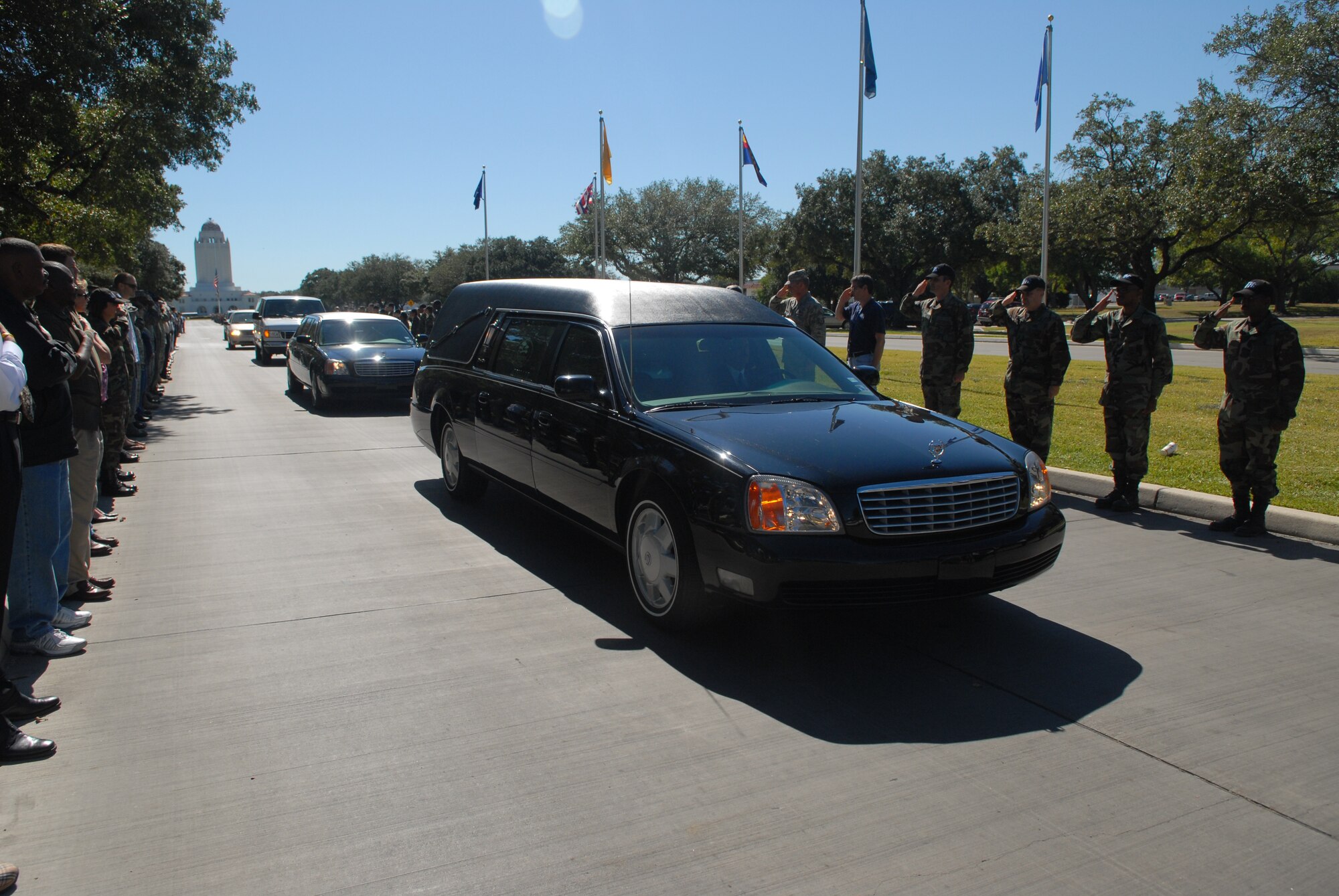 Hundreds of men and women at Randolph Air Force Base, Texas, line the streets Oct. 26 as a show of respect for U.S. Army Spc. Vincent A. Madero, a soldier killed while supporting Operation Iraqi Freedom.  Specialist Madero died Oct. 17 in Balad, Iraq, of wounds suffered when an improvised explosive device detonated near his Humvee.  Specialist Madero's body was flown to Randolph AFB and received by his family.  (U.S. Air Force photo/Joel Martinez)