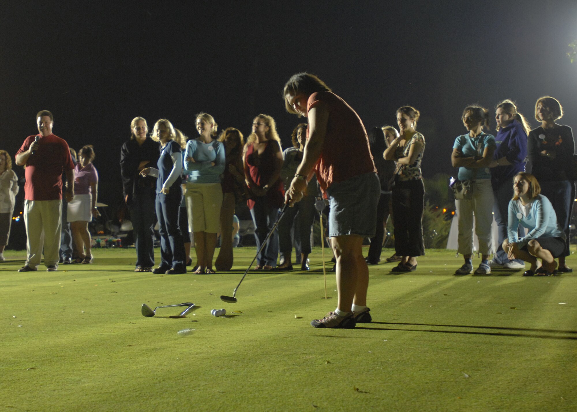 Leah Phillips, Incirlik Combined Spouses Club member, works the green during the Swingin’ Good Time putting contest Oct. 25 at the Hodja Lakes Golf Course. More than 50 club members and guests attended the event which also included a social hour and fashion show to display the newest women’s clothing line now available in the pro-shop.