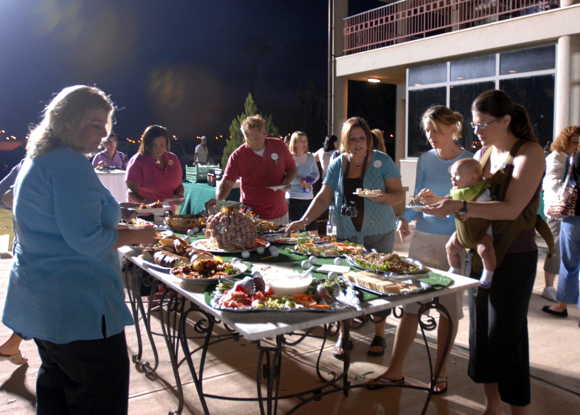 Members of the Incirlik Combined Spouses Club dined on dishes such as curry chicken salad, Thai chicken, shrimp wrapped in ham and Caprese salads during the Swingin’ Good Time party hosted at the Hodja Lakes Golf Course Oct. 25. The event, held on the patio of the golf course, included a social hour, a putting contest and a fashion show – complete with a red-carpet runway.