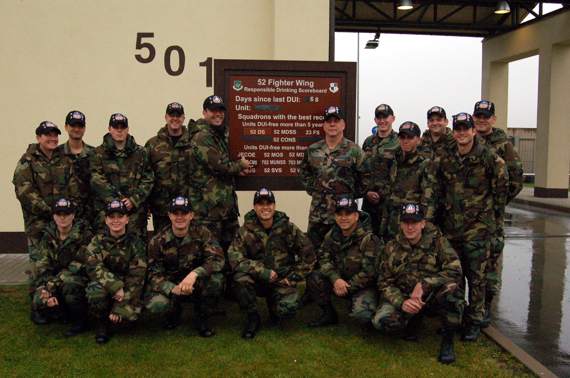 SPANGHDALEM AIR BASE, Germany – Maj. David Kincaid, 52nd Component Maintenance Squadron commander, places the units name on the on the 52nd Fighter Wing Responsible Drinking Scoreboard with fellow CMS Airmen to signify that the unit has gone one year without having a driving while under the influence incident Oct. 29. (U.S. Air Force photo/Staff Sgt. Tammie Moore)