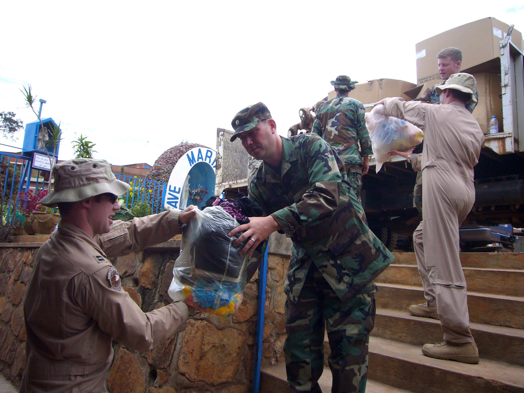 Members of the 786th Air Expeditionary Squadron deliver donations to an orphanage in Kigali, Rwanda, Oct. 27.  The Airmen from Ramstein Air Base, Germany, and Charleston Air Force Base, S.C., are in Kigali to provide airlift support to the Rwanda Defence Force.  (U.S. Air Force by Captain Erin Dorrance)
