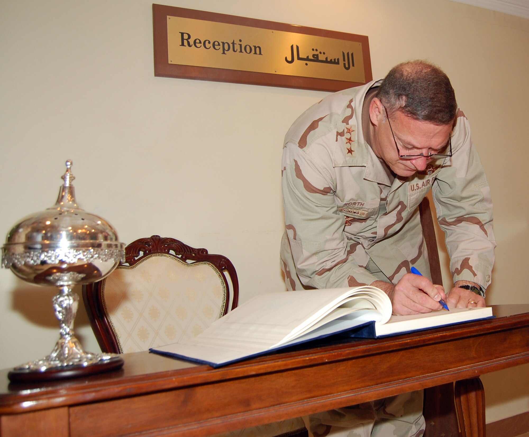 SOUTHWEST ASIA -- Lt. Gen. Gary North, 9th Air Force and U.S. Central Command Air Forces commander, signs the quest log Oct. 25 at a host nation’s breakfast in a undisclosed location. The breakfast was the first stop for the general. (Air Force photo by Staff Sgt Phillip Butterfield)