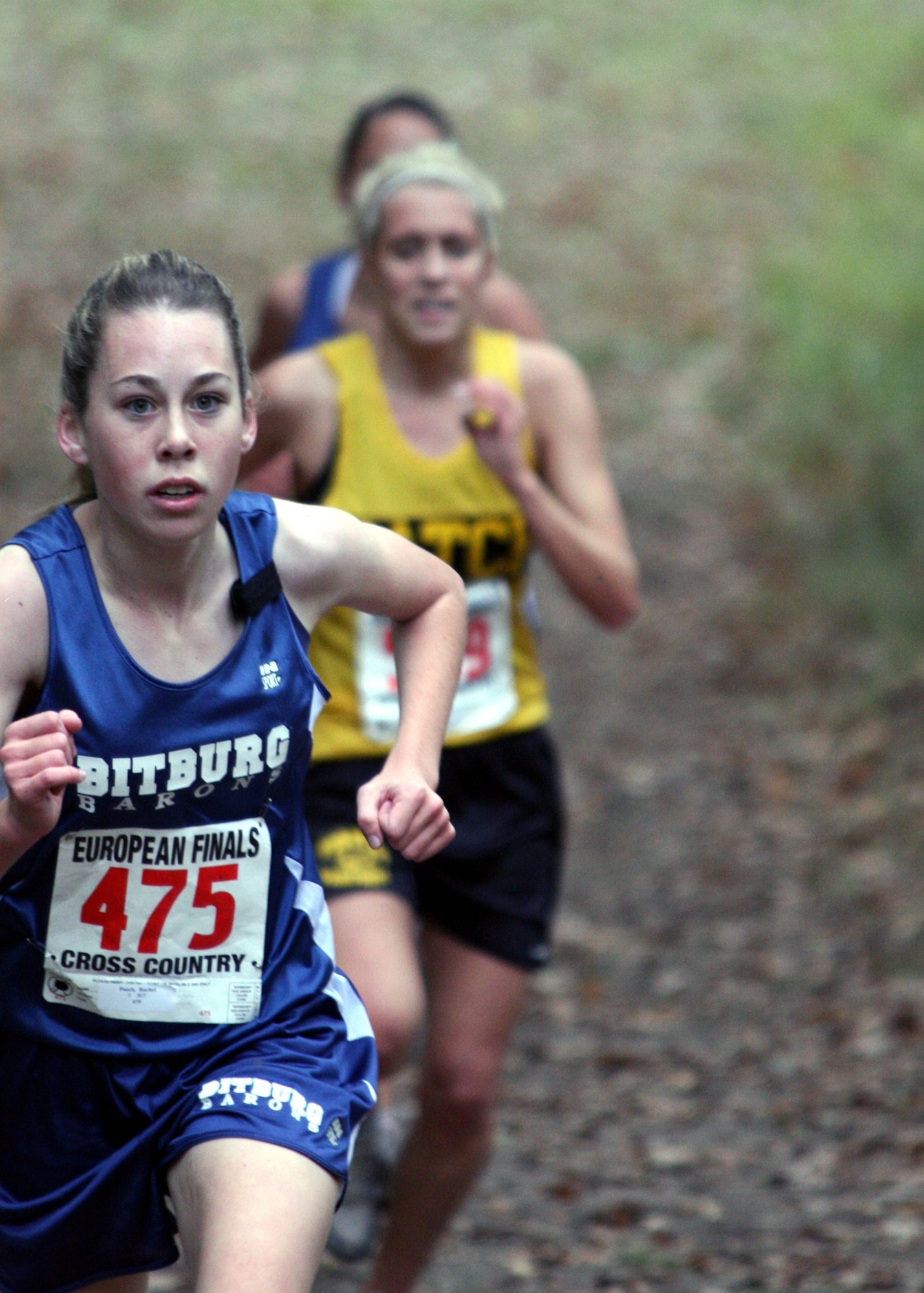 SCHWETZINGEN, Germany –Rachel Poock, Bitburg High School sophomore, leads favorites Maggie Redmond of Patch, Germany, and Sandra Davidson of BHS at the second kilometer. Poock finished second in the girls European Country Championship Division I-II race Oct. 28. (U.S. Air Force photo/ Capt. Lisa Barber)