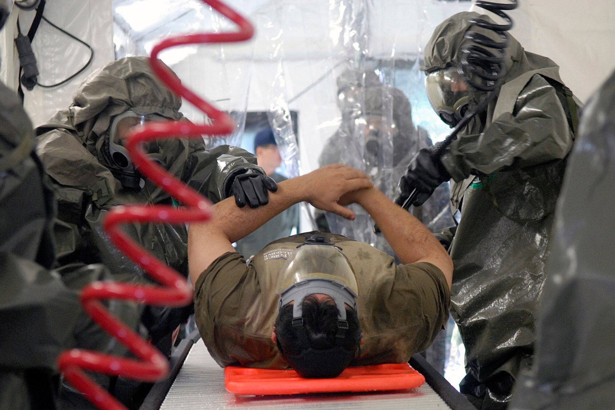 KUNSAN AIR BASE, South Korea – Lieutenant Roy Tomkus from the 944th Medical Squadron, goes through a disinfecting process during a simulated exercise scenario Oct. here 29.  The deployment mission of  the 944th Medical Squadron, Air Force Reserve, is to build up an Expeditionary Medical System (EMEDS) +25 Theater Hospital. This is the first time the 8th Medical Group will exercise this capability since receiving the equipment seven years ago. (U.S. Air Force photo/Senior Airman Giang Nguyen) 