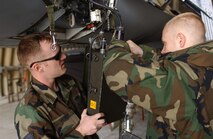 KUNSAN AIR BASE, South Korea -- Staff Sgt. Jonathan Vickery (left) and Staff Sgt. Joseph Filippone, (right) test equipment on an F-16 Fighting Falcon here Oct. 29. Sergeants Vickery and Filippone are maintainers with the 80th Aircraft Maintenance Unit. The 8th Fighter Wing is striving to do things smarter, especially with the entire Air Force having to now accomplish the mission with less. Implementing AFSO 21 ideas, the 8th Maintenance Group is implementing a time saving initiative where tool boxes will be kept in the hardened aircraft shelters (HAS) and consolidated tool kits have been standardized.  (U.S. Air Force photo/Senior Airman Steven R. Doty)                 