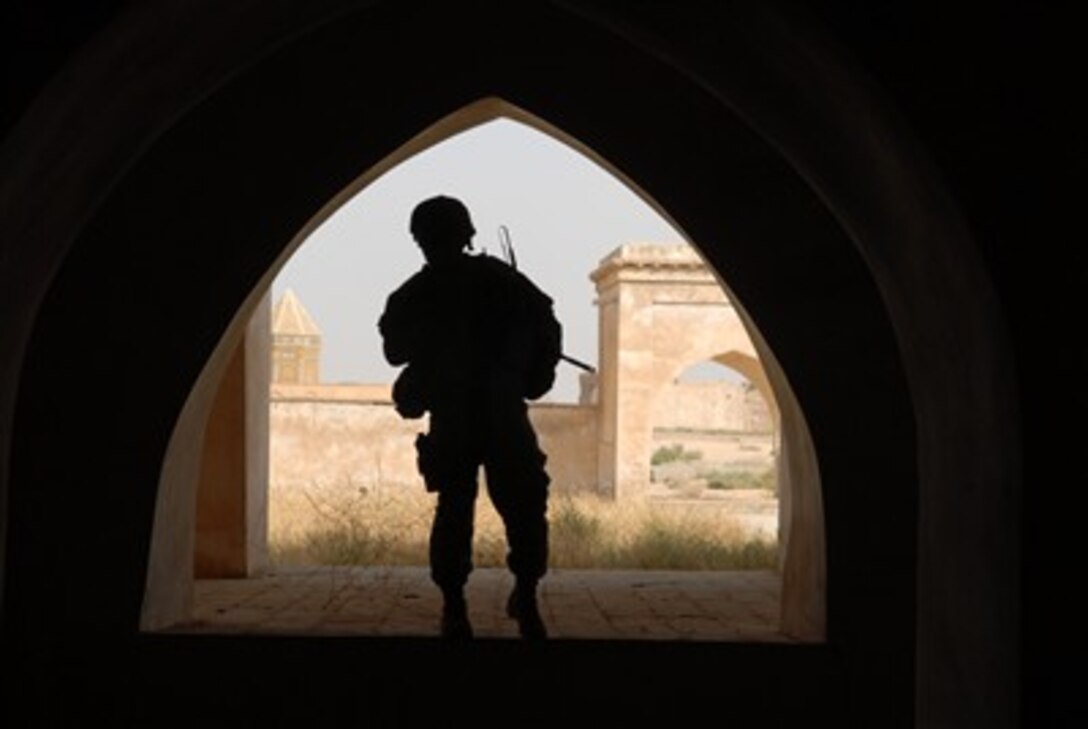 Army 2nd Lt. Andrew Archer is framed by an arch at the citadel in Kirkuk, Iraq, on Oct. 15, 2007.  Archer, of Delta Company, 2nd Battalion, 22nd Infantry Regiment, 1st Brigade Combat Team, 10th Mountain Division and civilians from the Kirkuk Provincial Reconstruction Team toured the historic site in Kirkuk.  