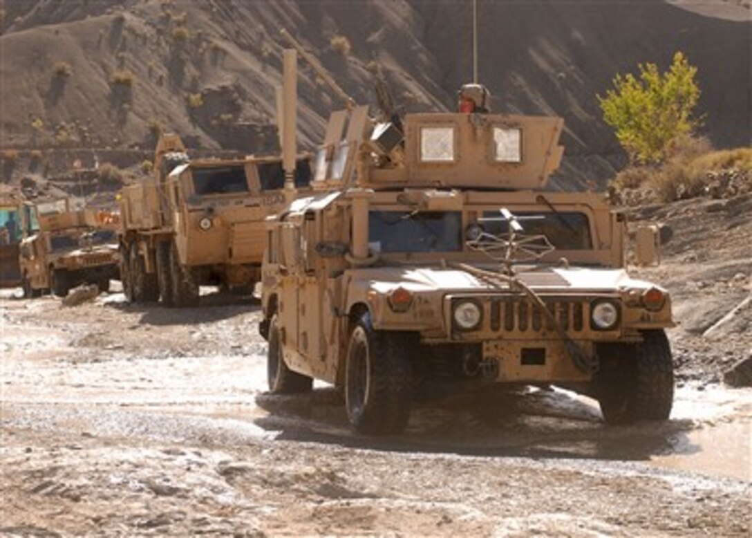 A Combat Logistics Patrol from the 782nd Brigade Support Battalion, 4th Brigade Combat Team, 82nd Airborne Division travels through a difficult route after completing a mission at the Bandar Command Observation Post in Paktika Province, Afghanistan, on Oct. 13, 2007.  