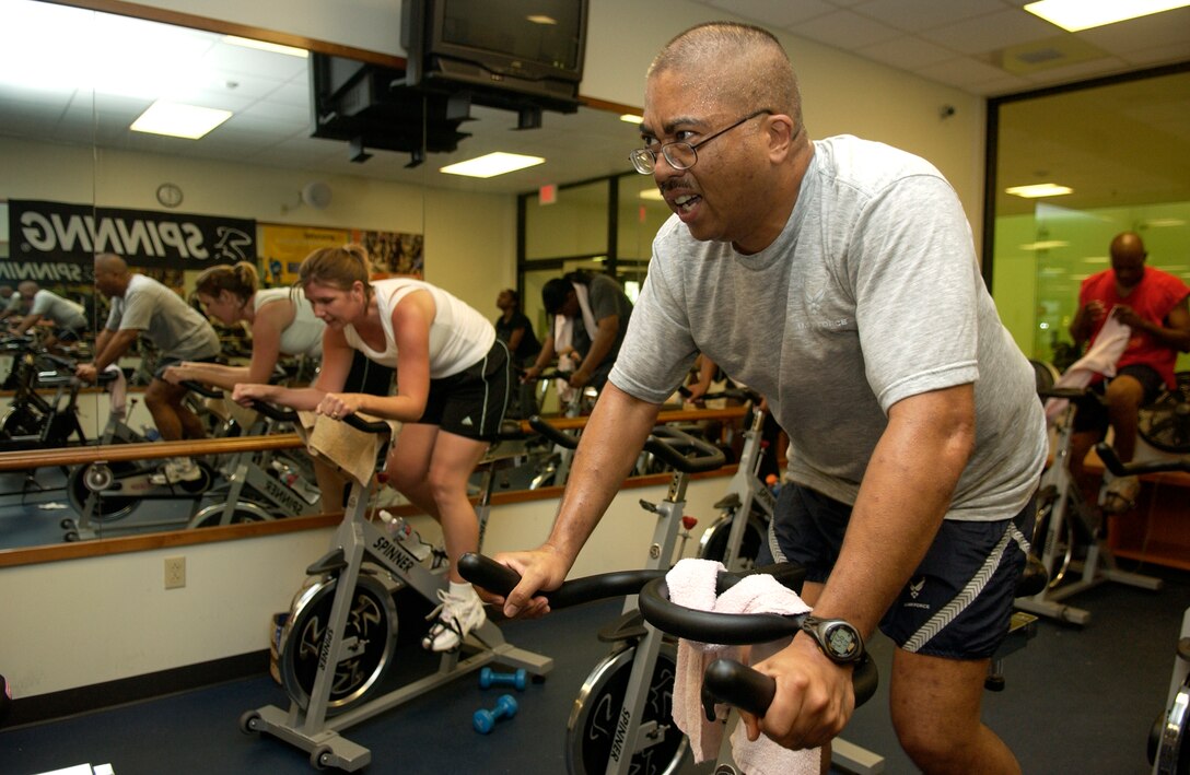 Master Sgt. David Domingo, 36th Contingency Response Group, participates in the spin portion of the Halloween Aerobithon Oct. 31, which consisted of back to back aerobic classes held in the Coral Reef Fitness Center.  The aerobithon also consisted of prizes and refreshments for participants. (U.S. Air Force photo/Senior Airman Miranda Moorer)                              
