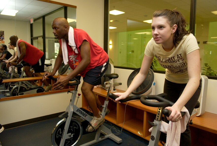 Airman 1st Class Emily Tolland, 36th Services Squadron, works out on the stationery bike during the Halloween Aerobithon Oct. 31, which consisted of back to back aerobic classes held in the Coral Reef Fitness Center.  (U.S. Air Force photo/Senior Airman Miranda Moorer)                              