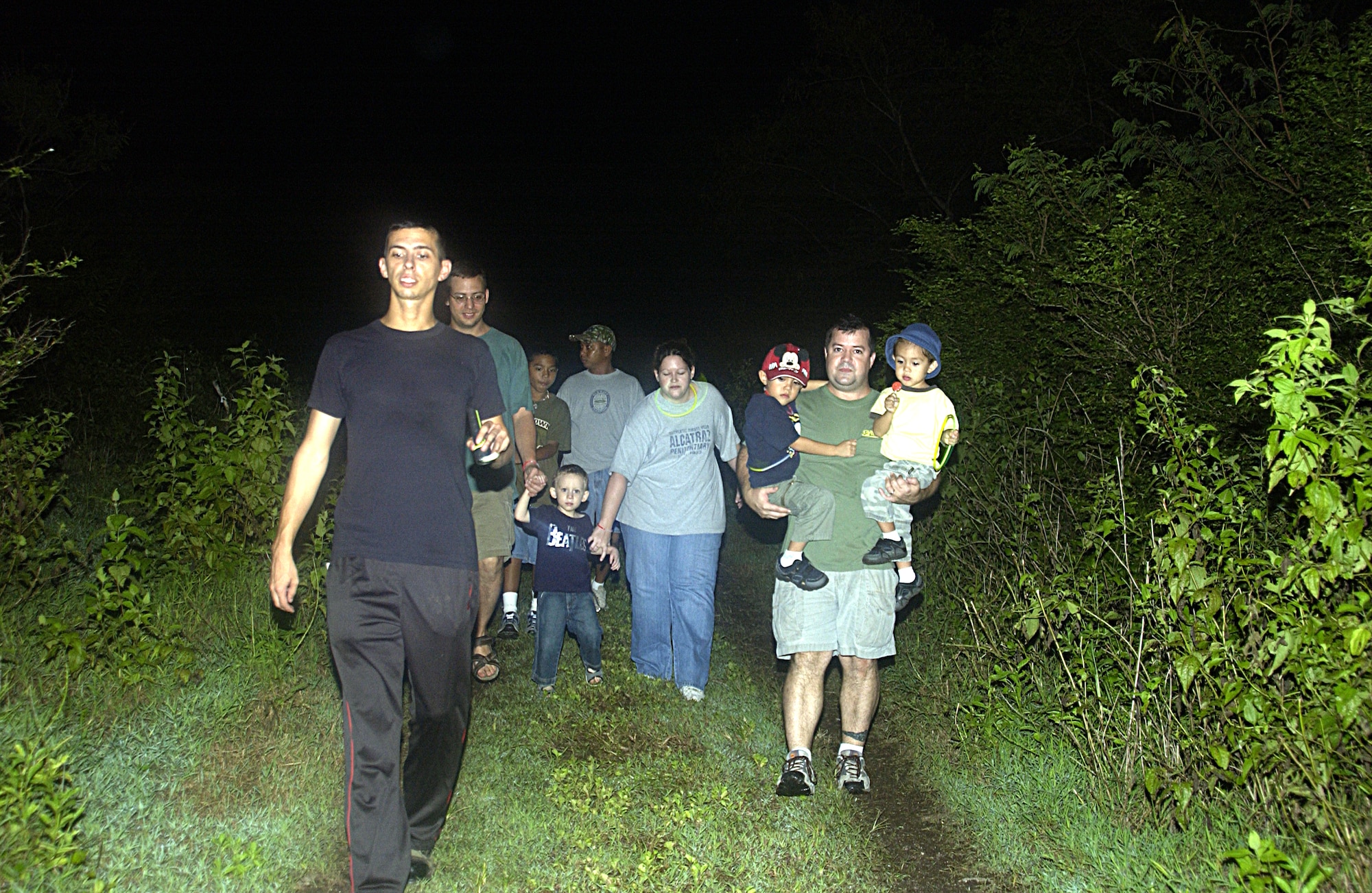 Senior Airman Nathan Coy, 734th Air Mobility Squadron, led a group along the 734th AMS's Haunted Trail Oct. 27. (U.S Air Force photo/Airman 1st Class Carissa Morgan)