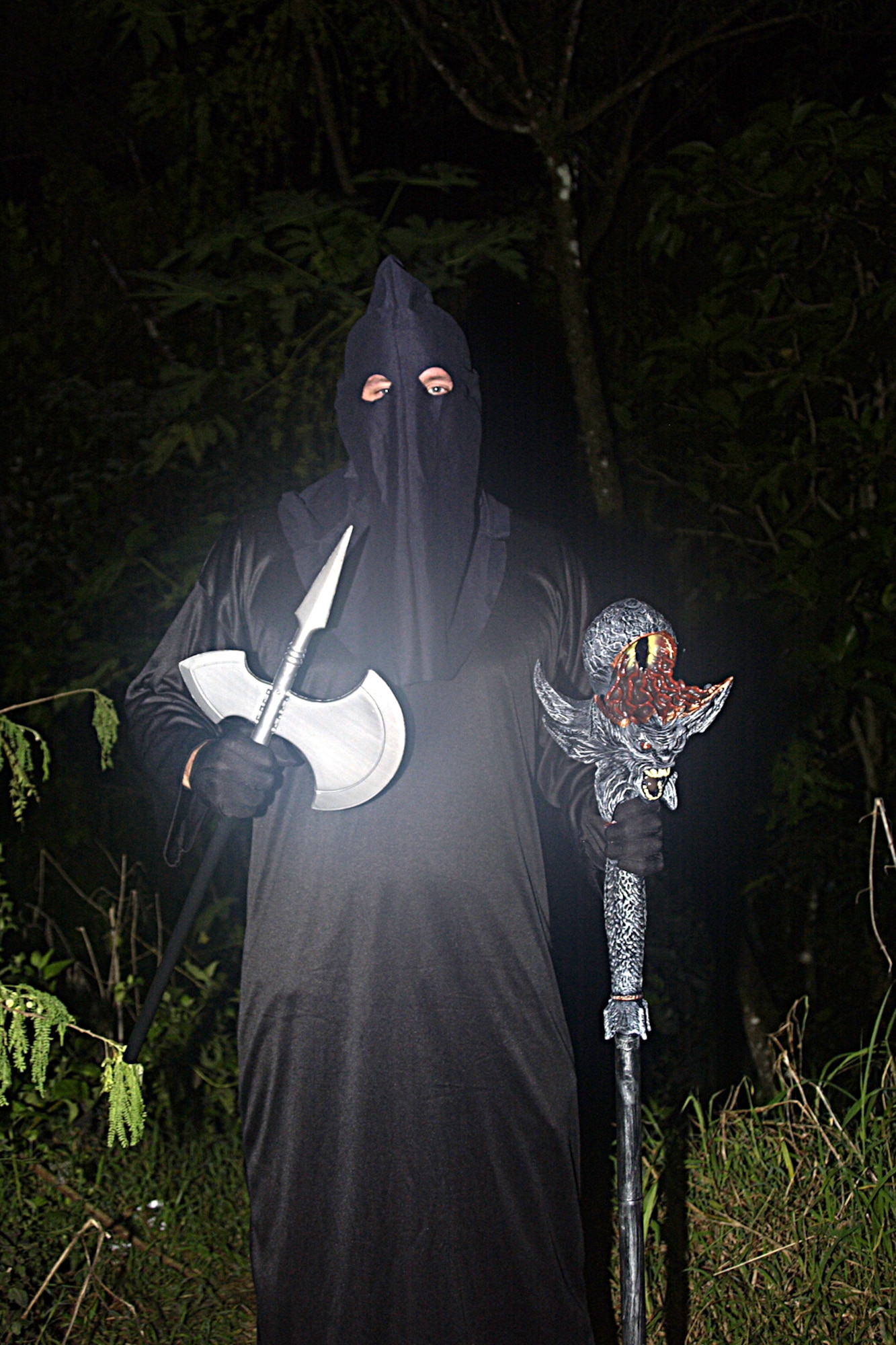 Staff Sgt. Mike McGrath, 734th Air Mobility Squadron, dressed as the grim reaper  jumped out of the dark to frighten visitors of the 734th AMS's Haunted Trail Oct. 27. (U.S Air Force photo/Airman 1st Class Carissa Morgan)