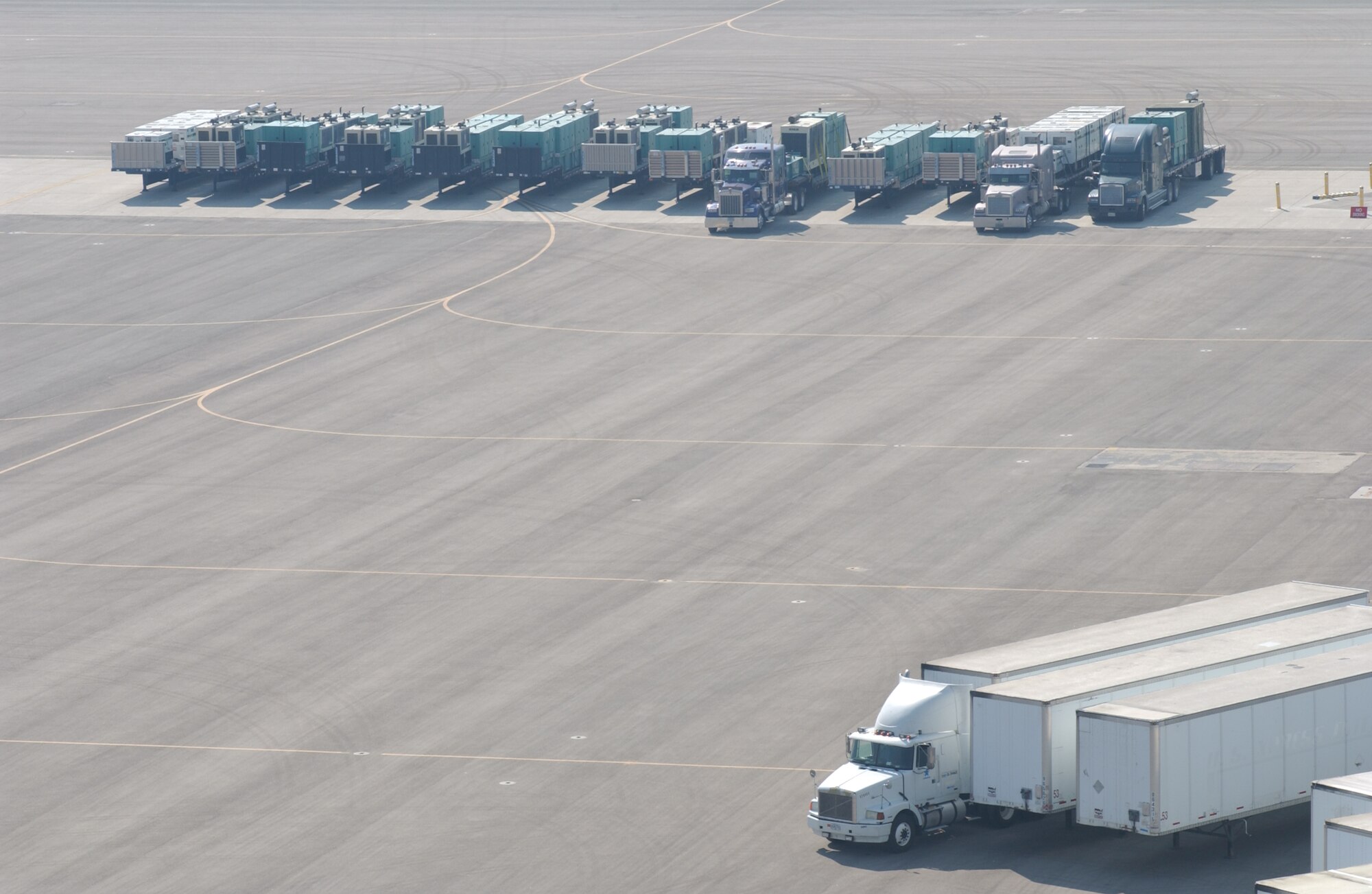 Federal Emergency Management Agency trucks assemble on the flightline of March Air Reserve Base in support of the Southern California firefighting efforts on October 26, 2007. (U. S. Air Force photo by Senior Airman Daniel St. Pierre) 
