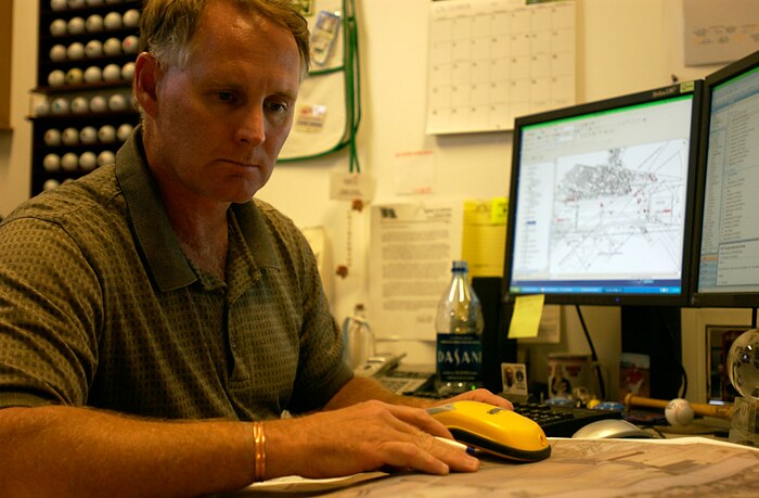 Roger Clarke, 99th Civil Engineer Squadron Geospatial information manager, uploads information from the mobile Geo XT into the Nellis GeoBase system Oct. 30 at Nellis AFB, Nev.  The GeoBase program provides Nellis Users with a Common Installation Picture, providing all users with an up-to-date, accurate representation of the installation. (U.S. Air Force photo by Airman 1st Class Ryan Whitney)  