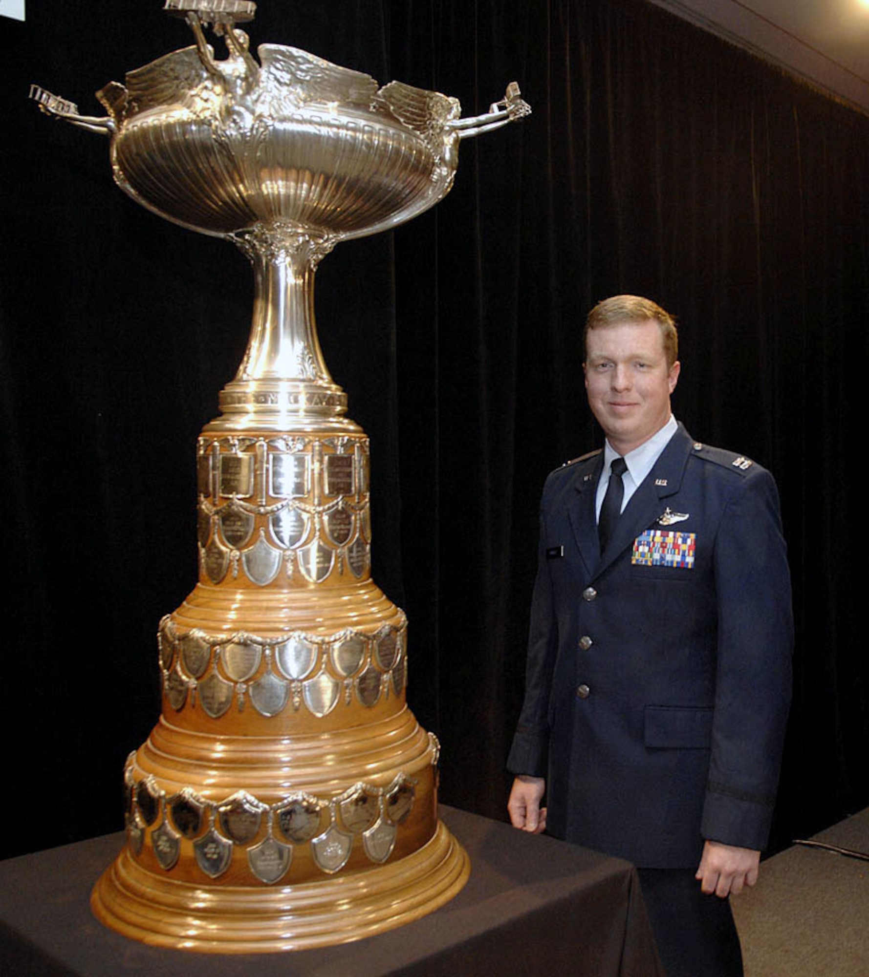 Capt. Scott L. Markle was presented the Clarence Mackay Trophy during a ceremony Oct. 29 in Arlington, Va. Captain Markle, an A-10 Thunderbolt II pilot with the 81st Fighter Squadron at Spangdahlem Air Base, Germany, received the award for his actions while supporting troops in contact with the enemy along the Afghanistan-Pakistan border. He is credited with destroying three machine gun nests and killing forty Taliban fighters. His actions saved the lives of 15 soldiers who were outnumbered three to one by the enemy. (Air Force Photo/Andy Morataya)