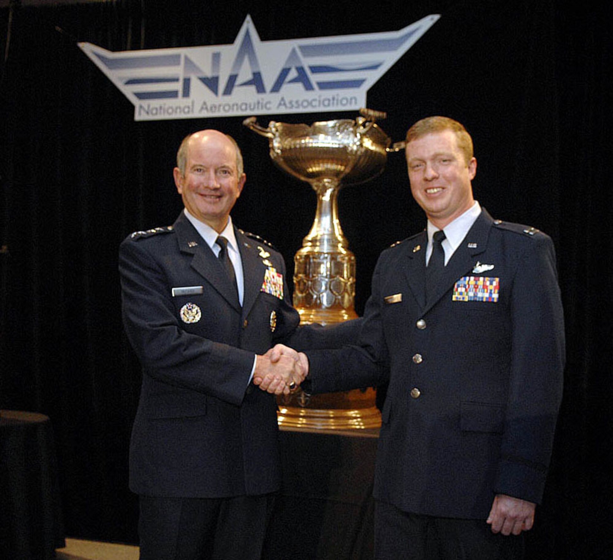 Air Force Vice Chief of Staff Gen. Duncan J. McNabb presented Capt. Scott Markle the Clarence Mackay Trophy during a ceremony Oct. 29 in Arlington, Va.  Air Force and National Aeronautic Association officials present the award to Airmen or an organization involved in the most meritorious flight of the year. Captain Markle an A-10 Thunderbolt II pilot from the 81st Fighter Squadron at Spangdahlem Air Base, Germany. (U.S Air Force photo/Andy Morataya)