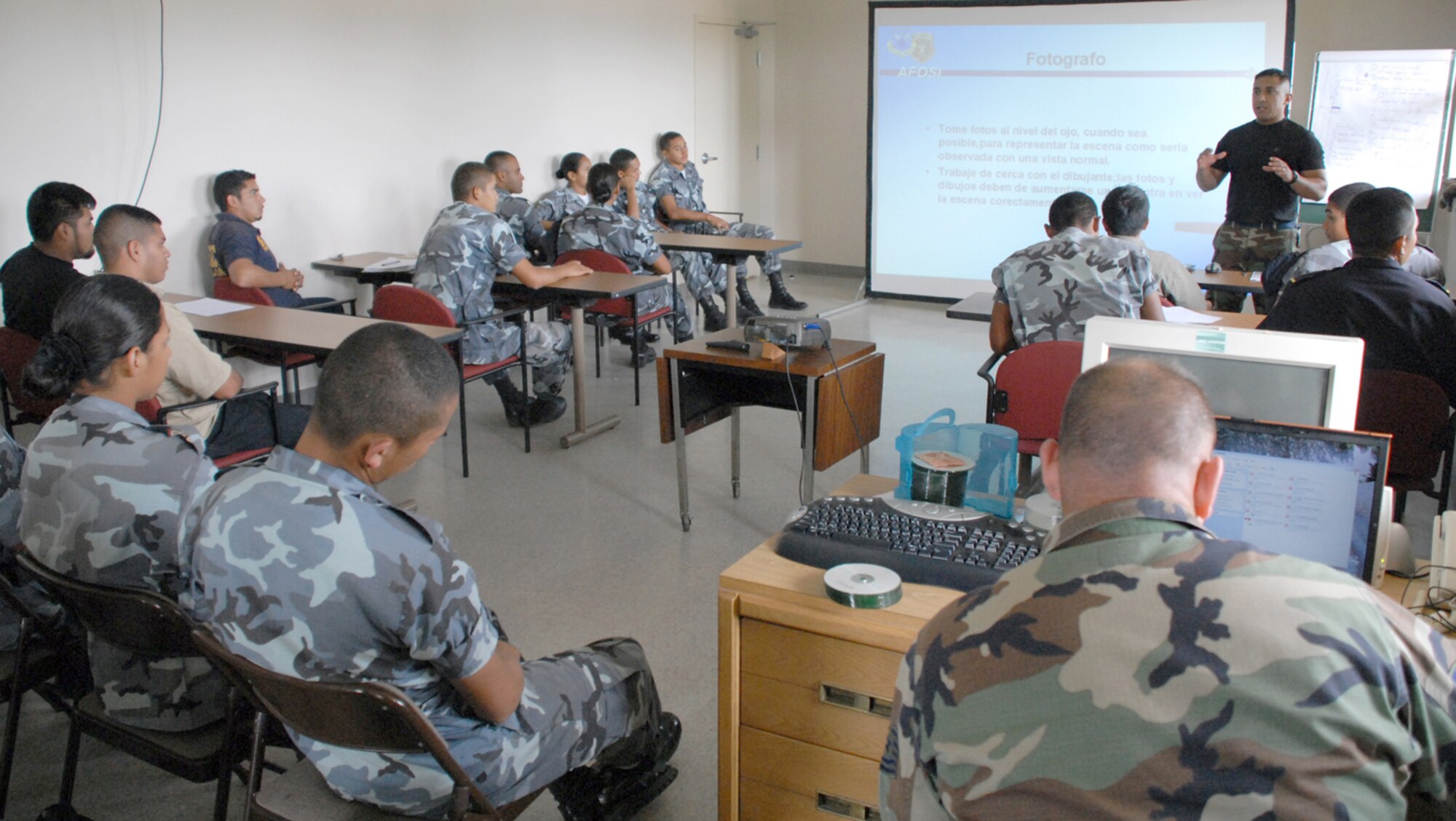 Staff Sgt. Edgar Castro, joint security forces, reviews crime scene procedures with police from nearby Comayagua and La Paz police divisions, as well as cadets from the La Paz Police Academy. The course is one in a series of classes taught this year, with other lessons involving handcuff procedures, high-risk traffic stops and riot control. (U.S. Air Force photo/Tech. Sgt. Sonny Cohrs)
