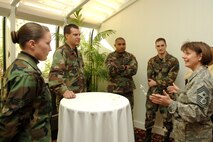 HANSCOM AFB, Mass. – Chief Master Sgt. Lisa Sirois (far left), 66th Air Base Wing and Electronic Systems Center command chief, chats with fellow Airmen during her Farewell Social Oct. 30. Members of the base community gathered to say goodbye to the chief, who is scheduled to leave Hanscom in November for a year-long short tour to Manas Air Base, Kyrgyzstan. (U.S. Air Force Photo by Jan Abate.)